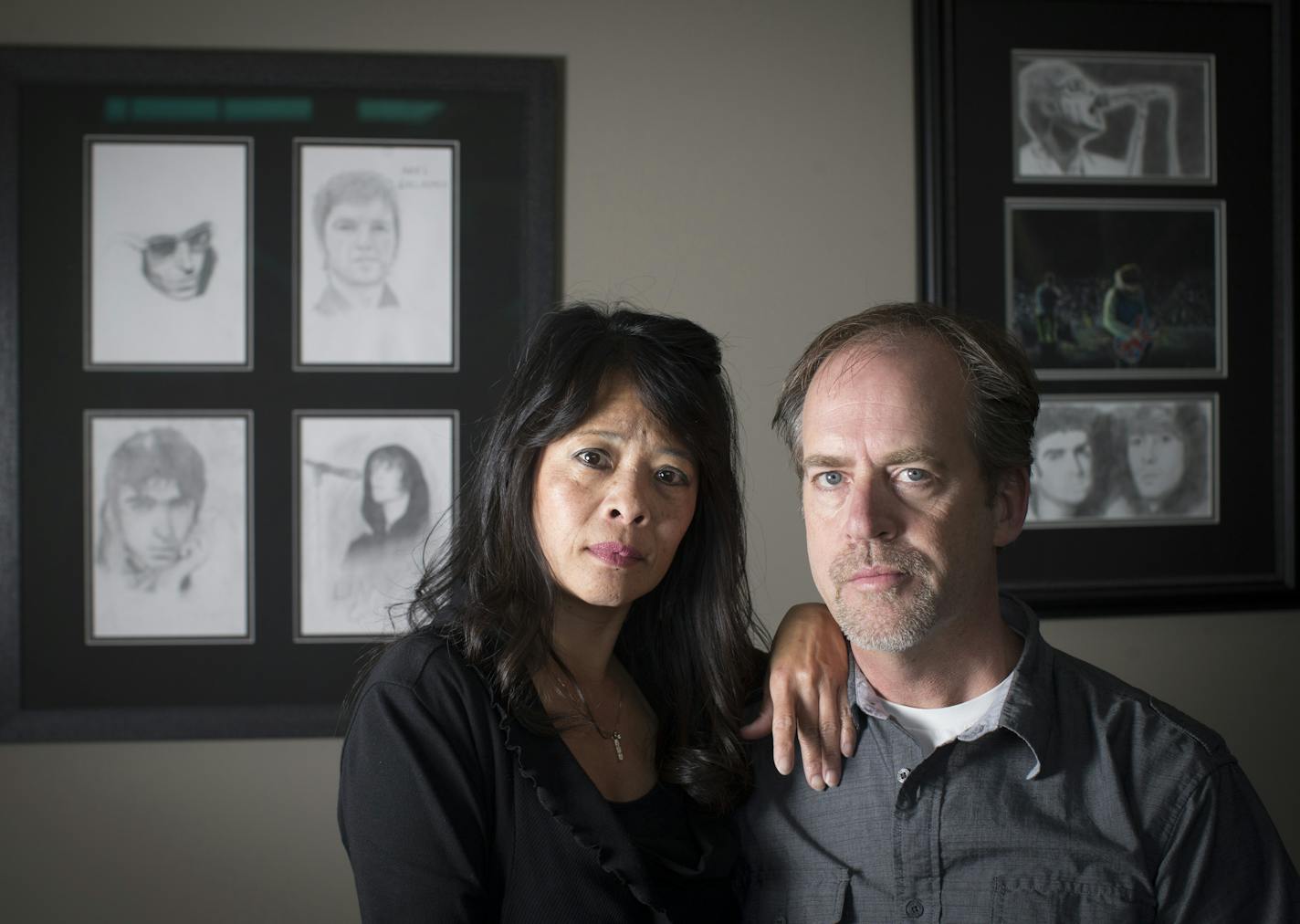 Mai and Tom Fitzgerald posed for a picture in front of their daughter Tara's artwork in their home in Woodbury, Minn., on Tuesday, March 31, 2015. Tara Fitzgerald, 17, died Jan. 11, just hours after taking a synthetic tablet that was marketed as LSD. ] RENEE JONES SCHNEIDER &#xef; reneejones@startribune.com