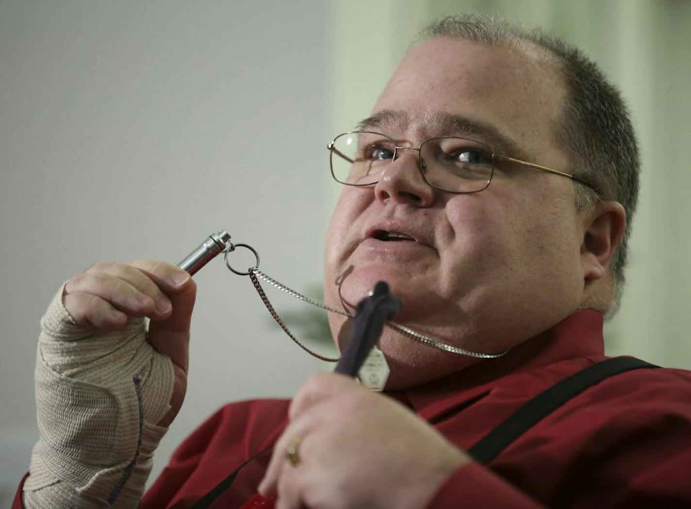 Patrick McClellan, who has been enrolled in Minnesota's medical cannabis program from day one, hopes upcoming changes make the program more affordable and accessible. In this December 2015 photo, he holds up the cannabis vaporizer he uses to ease pain and muscle spasms. Star Tribune photo by Jeff Wheeler