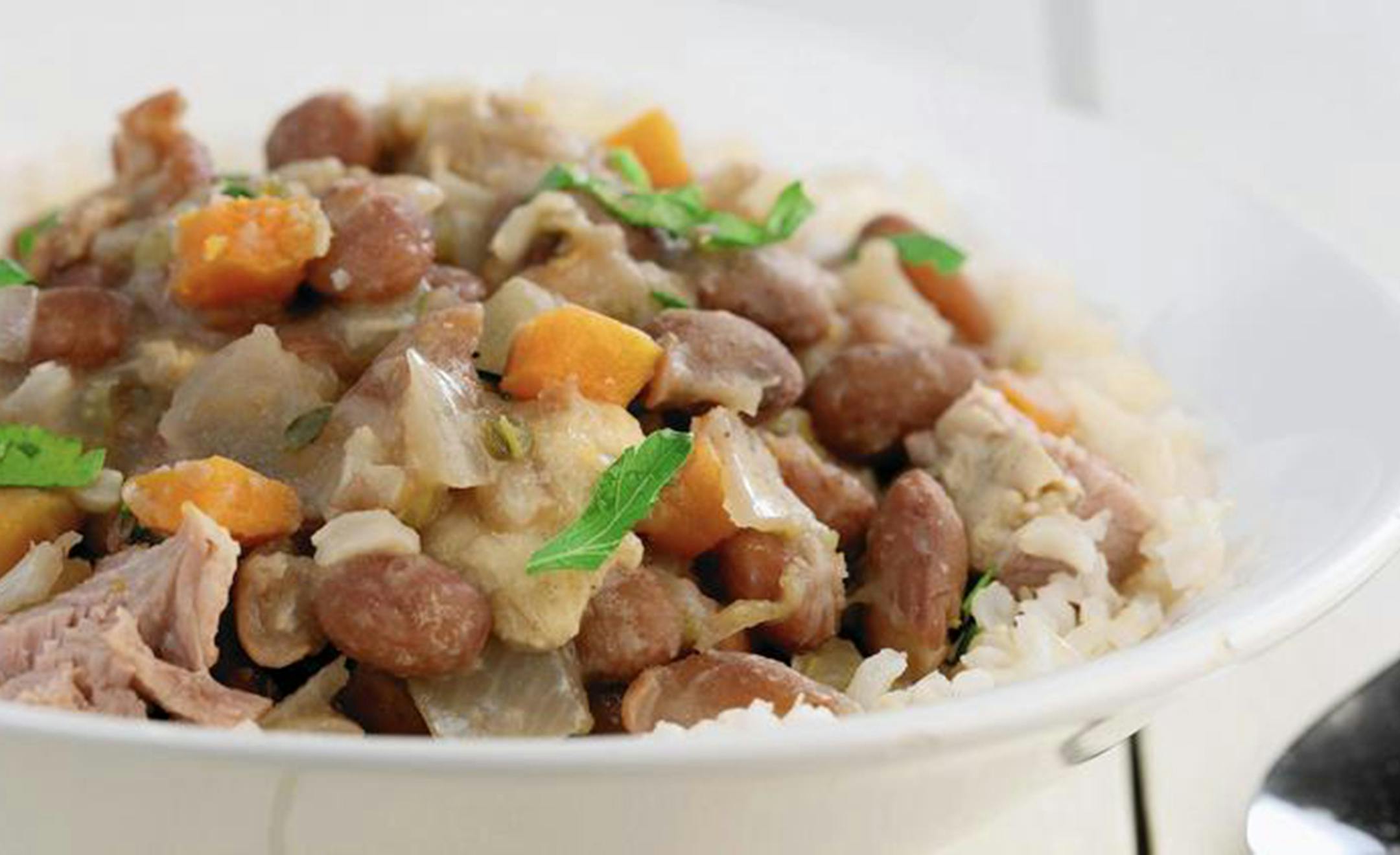 Beans are cooked with plenty of aromatic vegetables for a spin on red beans and rice. (Michael Tercha/Chicago Tribune/TNS) ORG XMIT: 1178472
