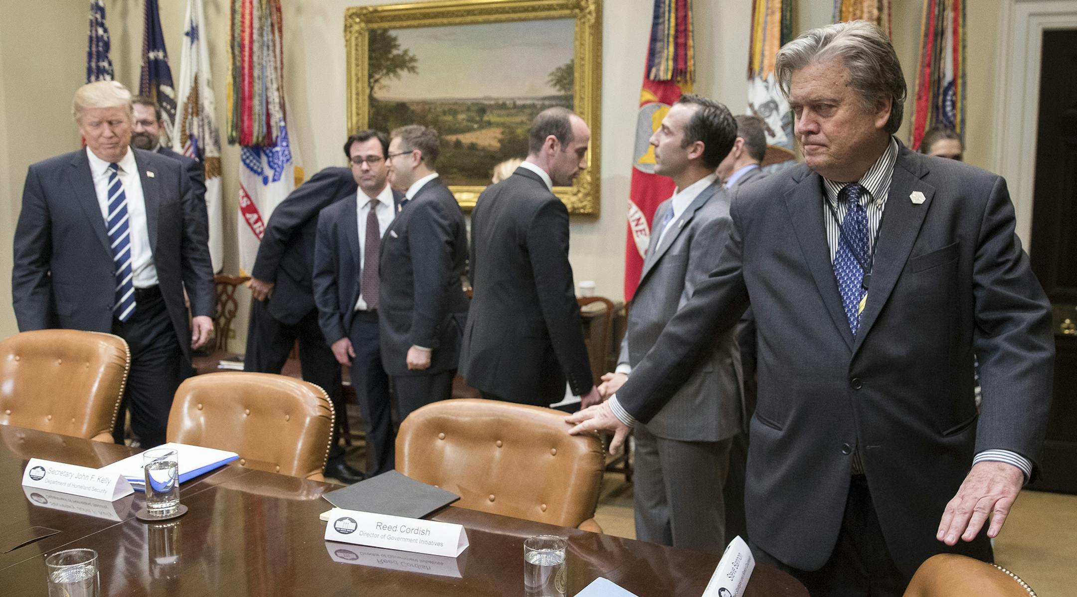 President Donald Trump, and Stephen Bannon, right, Trump's chief strategist, before a meeting between Trump and former New York City Mayor Rudy Giuliani about cyber security, at the White House in Washington, Jan. 31, 2017. (Stephen Crowley/The New York Times) ORG XMIT: MIN2017020217420832