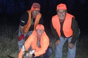 On a recent Missouri deer hunt, Star Tribune reporter Abby Simons, center, and the doe she shot are flanked by Simons' friend Phil Replogle, left, and