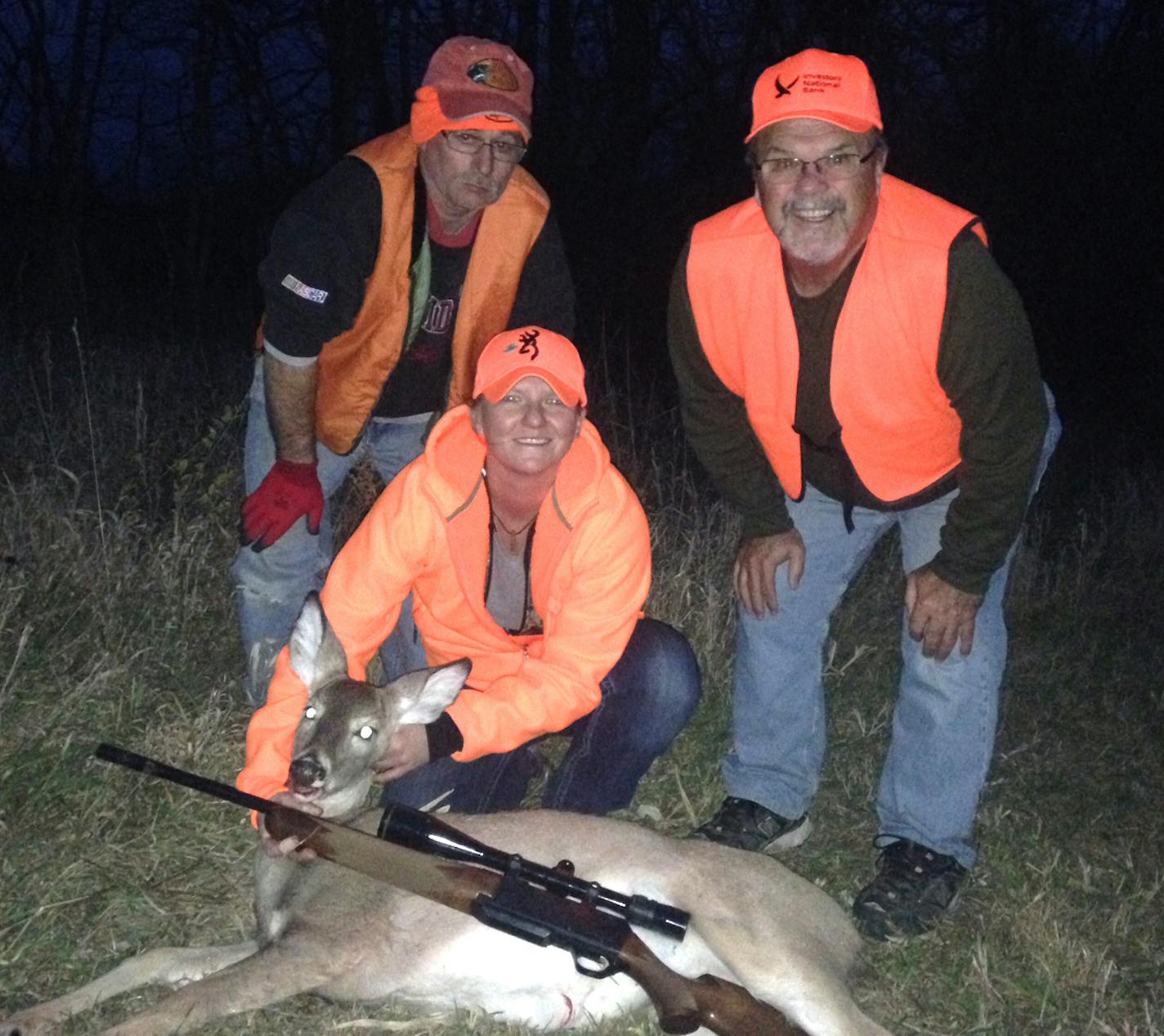 On a recent Missouri deer hunt, Star Tribune reporter Abby Simons, center, and the doe she shot are flanked by Simons' friend Phil Replogle, left, and her stepfather, Ed Ostervich.