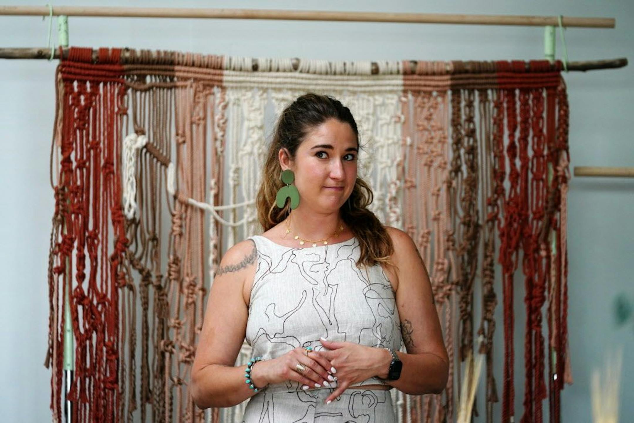 Emily Katz stood in front of one of the macrame pieces she's working on as she introduced herself to the class.