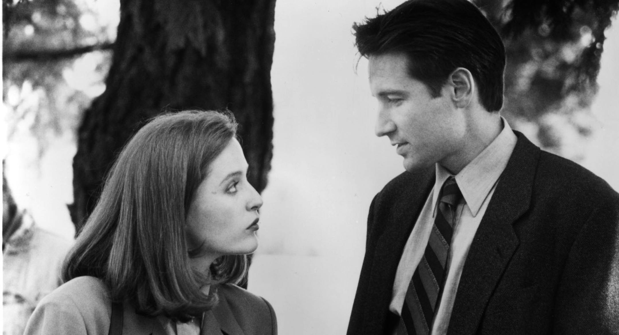Gillian Anderson (at left) and David Duchovny (right) star in the television show "The X-Files" -- 1993 handout photo courtesy of Fox Broadcasting.