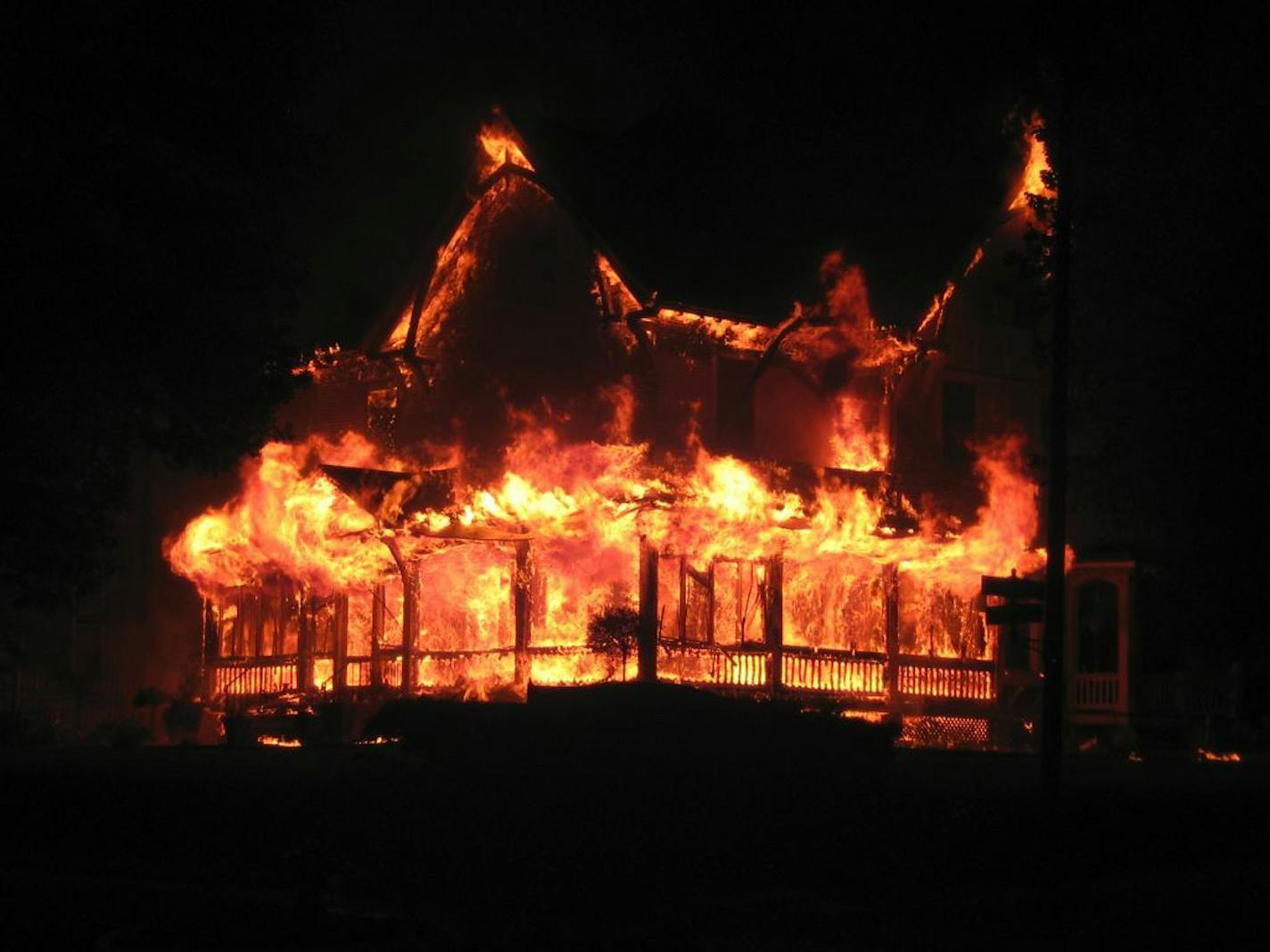 Flames engulf the Bohemian Bed & Breakfast, in New Ulm, Minn., during a fire around 2 a.m. Saturday.