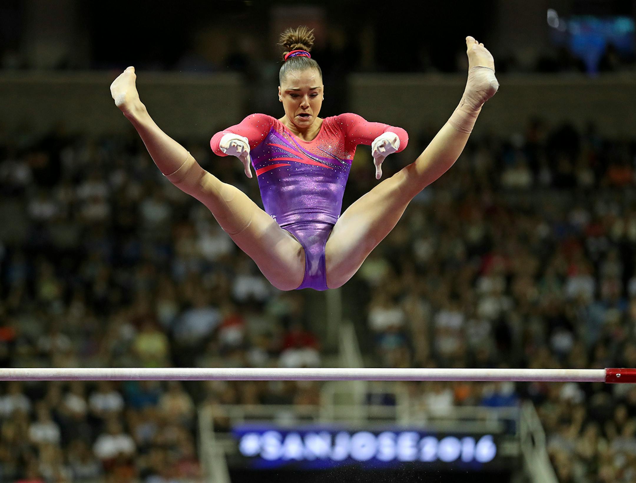 Day 1 - Maggie Nichols performs on the uneven bars.