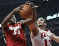 Miami Heat center Joel Anthony, left, and Chicago Bulls center Joakim Noah reach for a rebound during the first quarter of Game 5 of the NBA basketbal