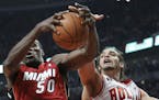 Miami Heat center Joel Anthony, left, and Chicago Bulls center Joakim Noah reach for a rebound during the first quarter of Game 5 of the NBA basketbal