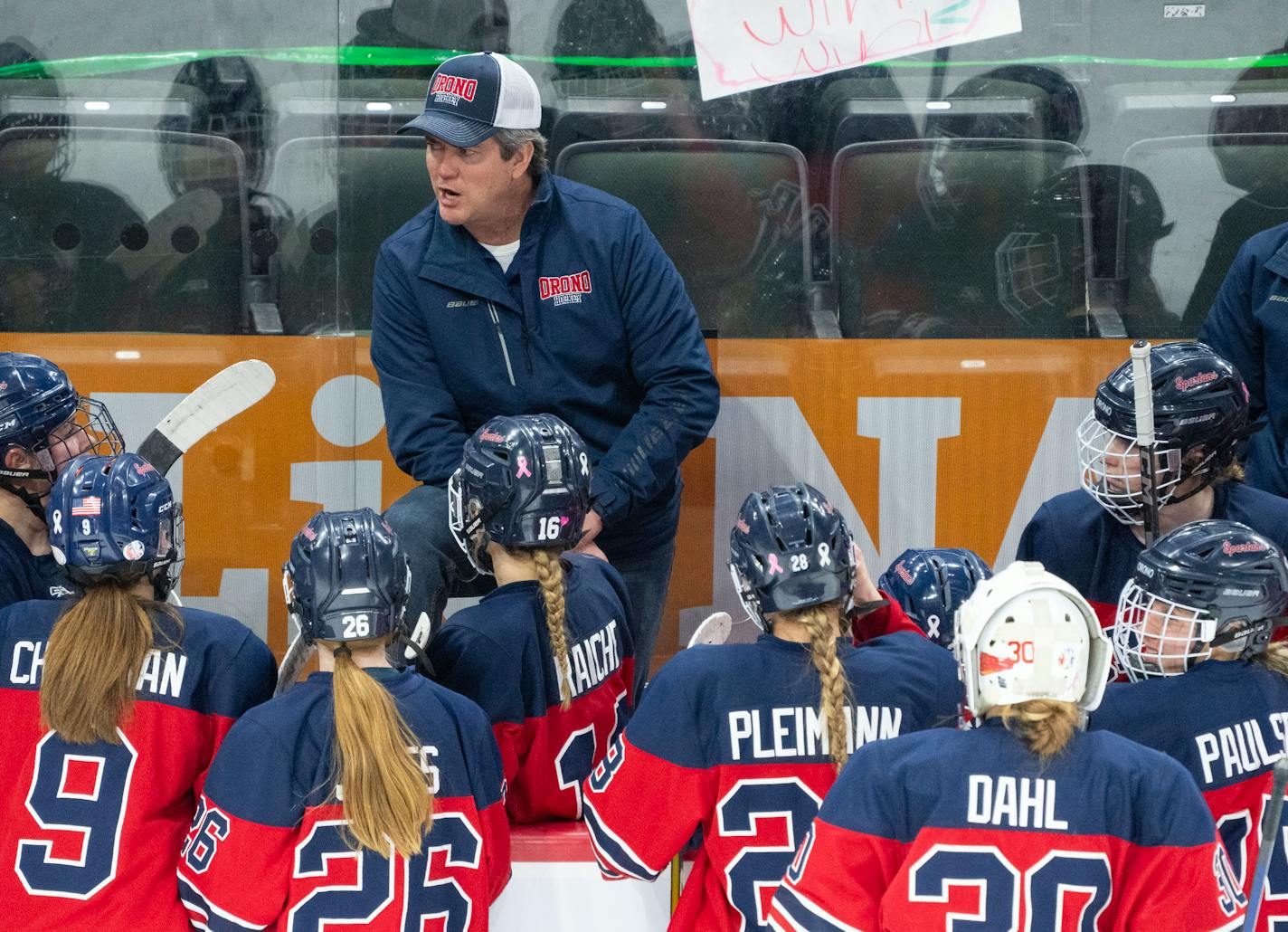 Orono head coach Larry Olimb talks with his team during a timeout in the second period of the Class 1A girl's hockey championship Saturday, Feb. 25, 2023 at Xcel Energy Arena in St. Paul. ]