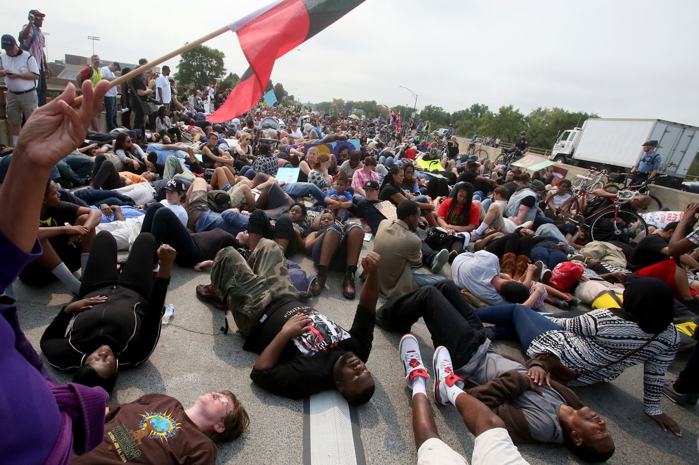 Black Lives Matter Minnesota vows to disrupt the State Fair's first Saturday by assembling at Hamline Park and marching to the Minnesota State Fairgrounds entrance Saturday, Aug. 29, 2015, in St. Paul. Here, Black Lives Matter protestors held a die in on Snelling Avenue near the State Fair.](DAVID JOLES/STARTRIBUNE)djoles@startribune.com Black Lives Matter Minnesota vows to disrupt State Fair's first Saturday by assembling at Hamline Park and marching to the fairgrounds entrance.