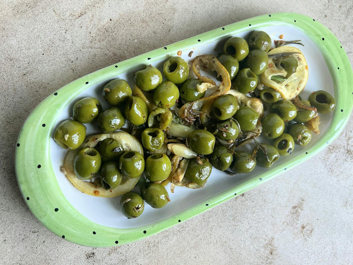 Herb-roasted olives are an easy nosh for a summer party. (Gretchen McKay/Pittsburgh Post-Gazette/TNS)