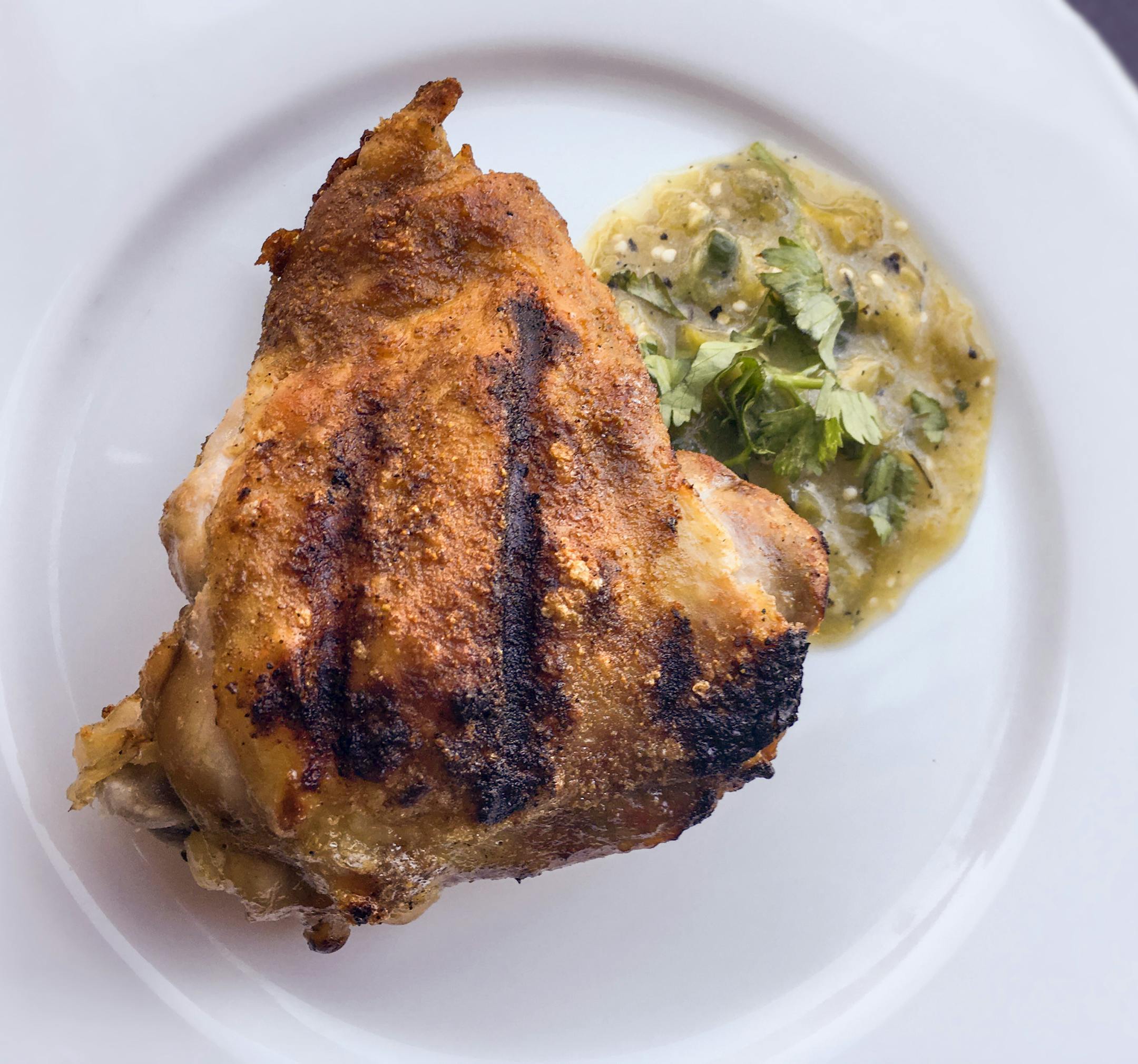 Cumin-Crusted Chicken Thighs With Grilled Salsa.