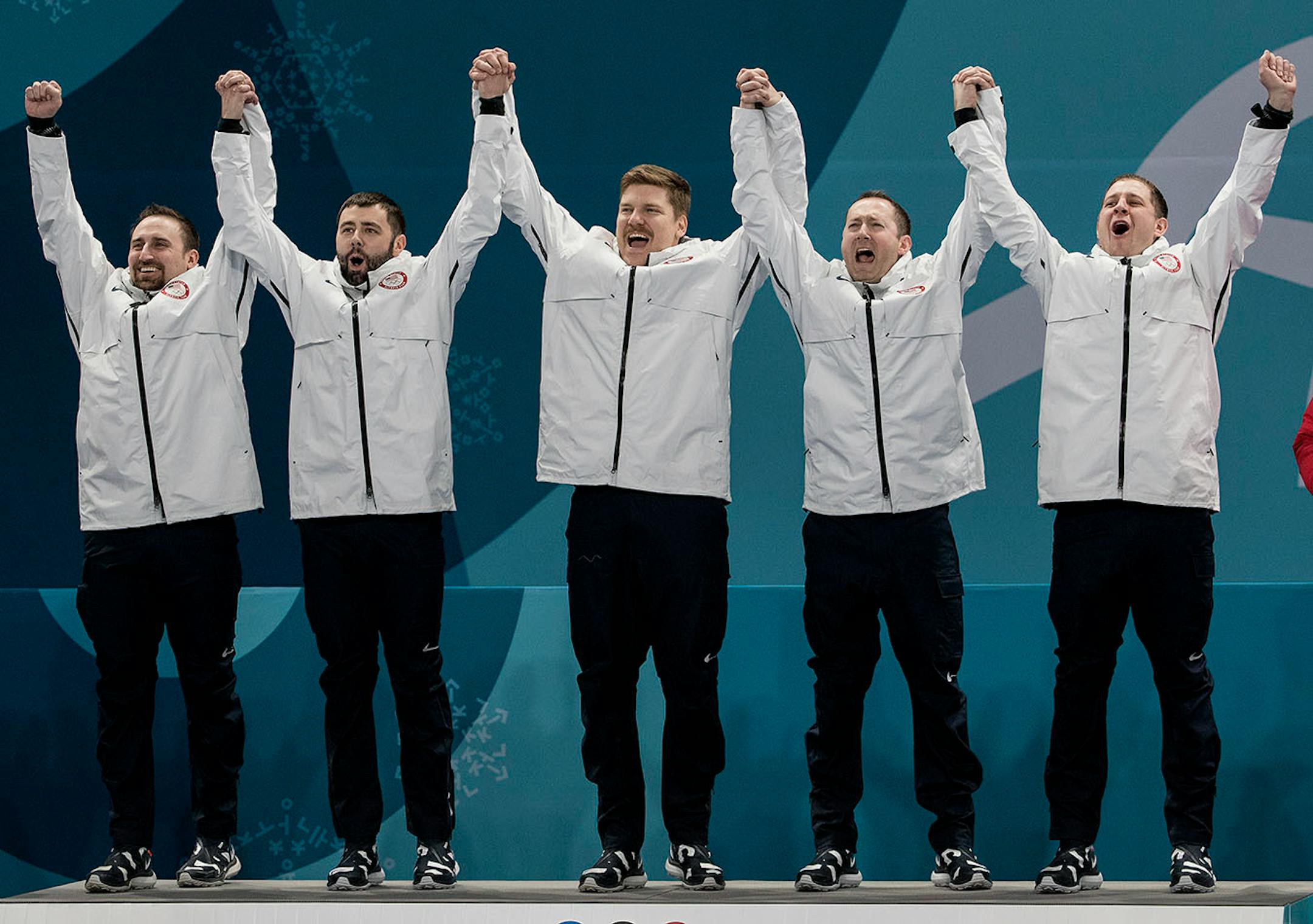 Team USA celebrates a 10-7 win in the gold-medal match against Sweden on Saturday, Feb. 24, 2018, at the Pyeongchang Winter Olympics' Gangneung Curling Centre.