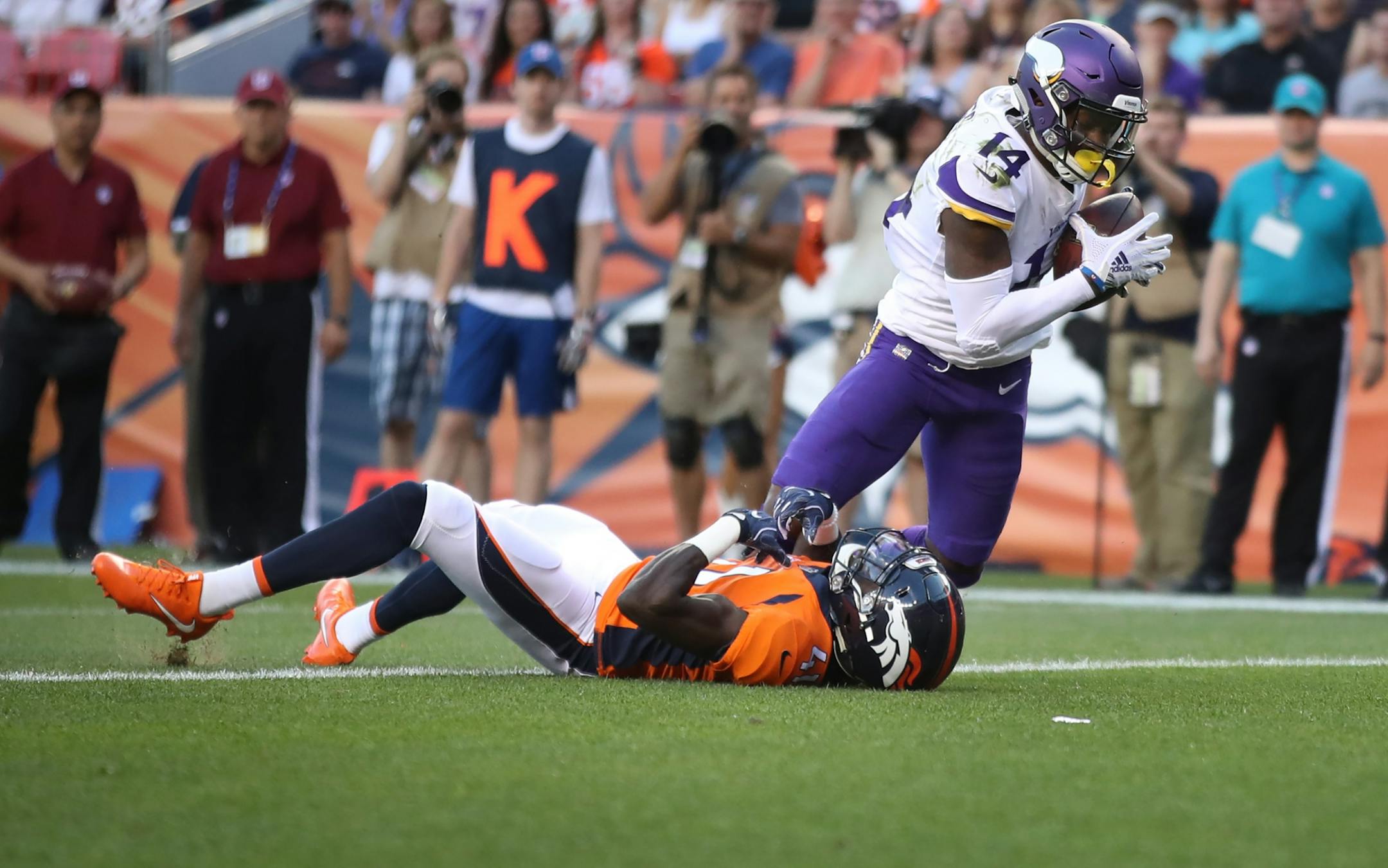 Minnesota Vikings wide receiver Stefon Diggs (14) caught a first quarter touchdown over Denver Broncos cornerback Isaac Yiadom (41) Saturday August 11, 2018 at Mile High Stadium in Denver, CO.