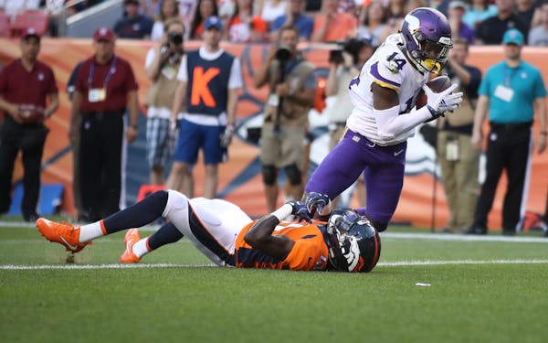 Minnesota Vikings wide receiver Stefon Diggs (14) caught a first quarter touchdown over Denver Broncos cornerback Isaac Yiadom (41) Saturday August 11