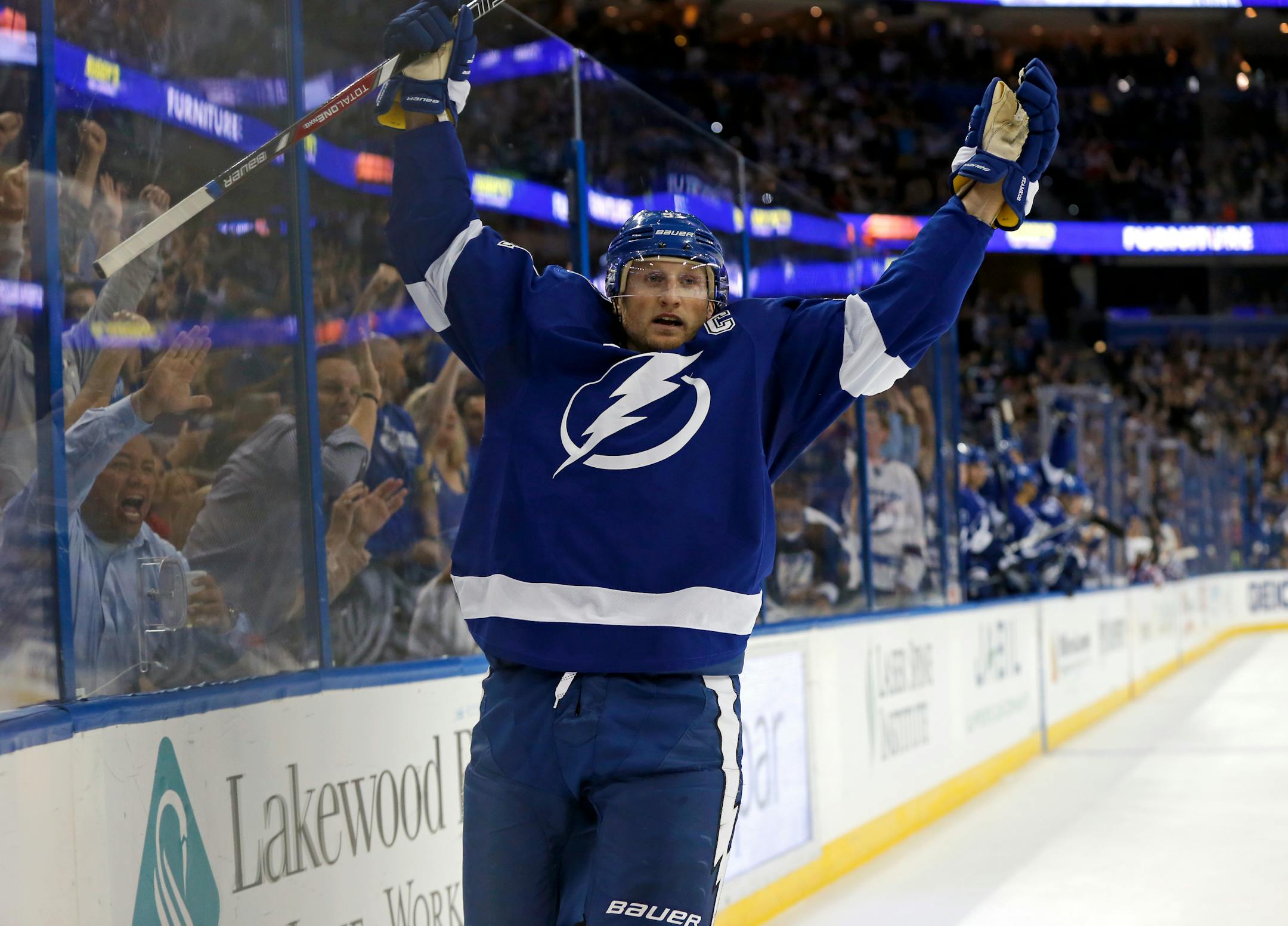 Tampa Bay Lightning's Steven Stamkos celebrates his third goal of the game against the Montreal Canadiens during the second period of an NHL hockey game Monday, Oct. 13, 2014, in Tampa, Fla. (AP Photo/Mike Carlson)