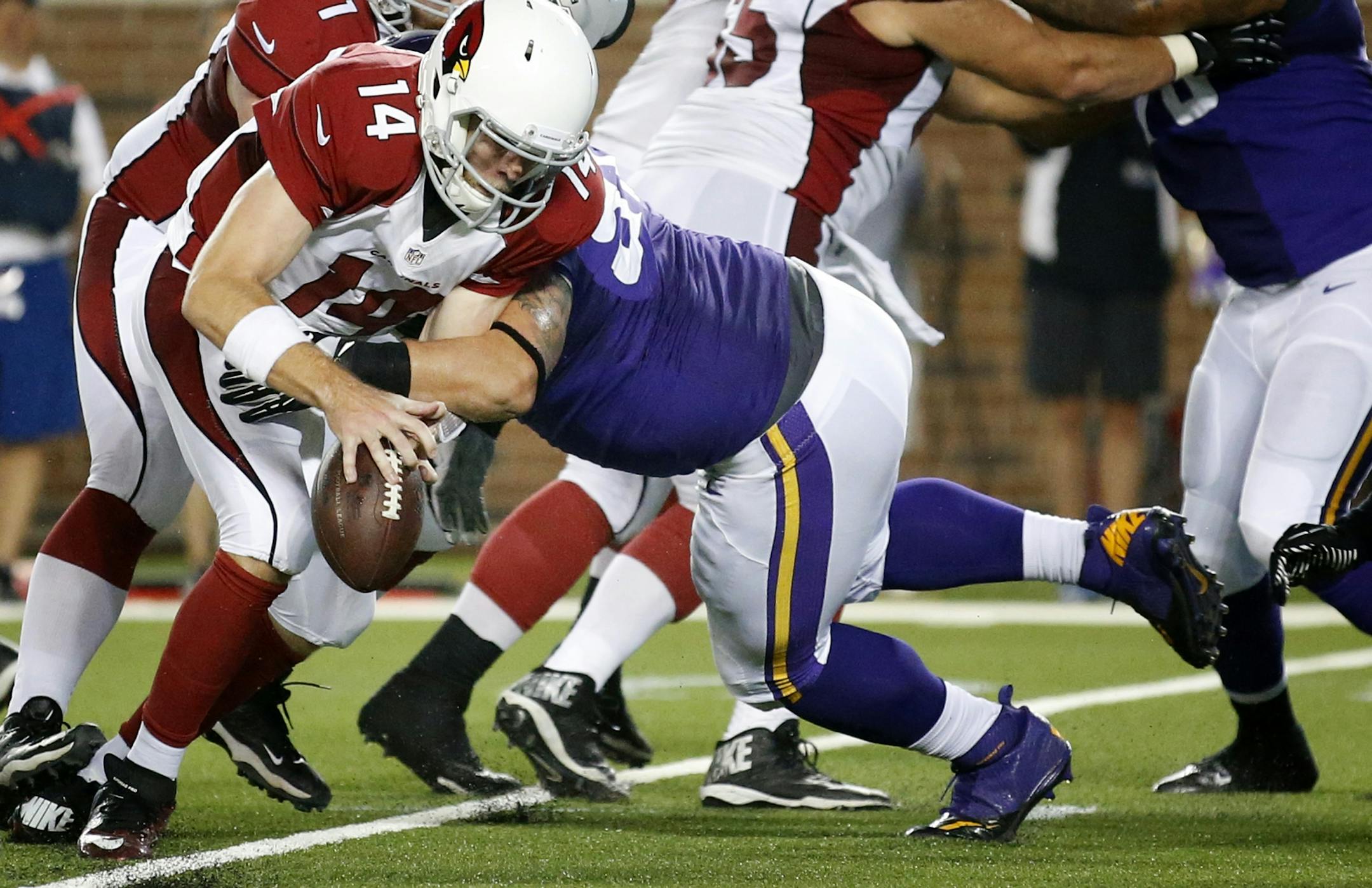 Chase Baker (91) pressured Ryan Lindley (14) in the fourth quarter. The play resulted in a touchdown for Arizona.