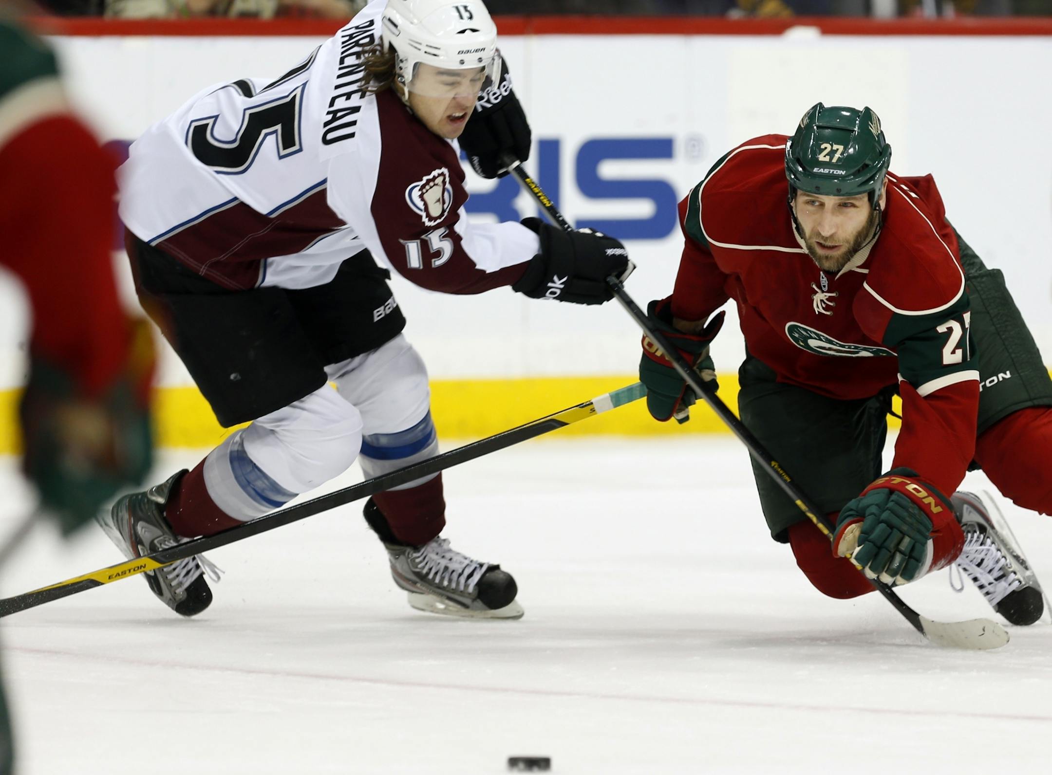 Wild forward Mike Rupp (right)