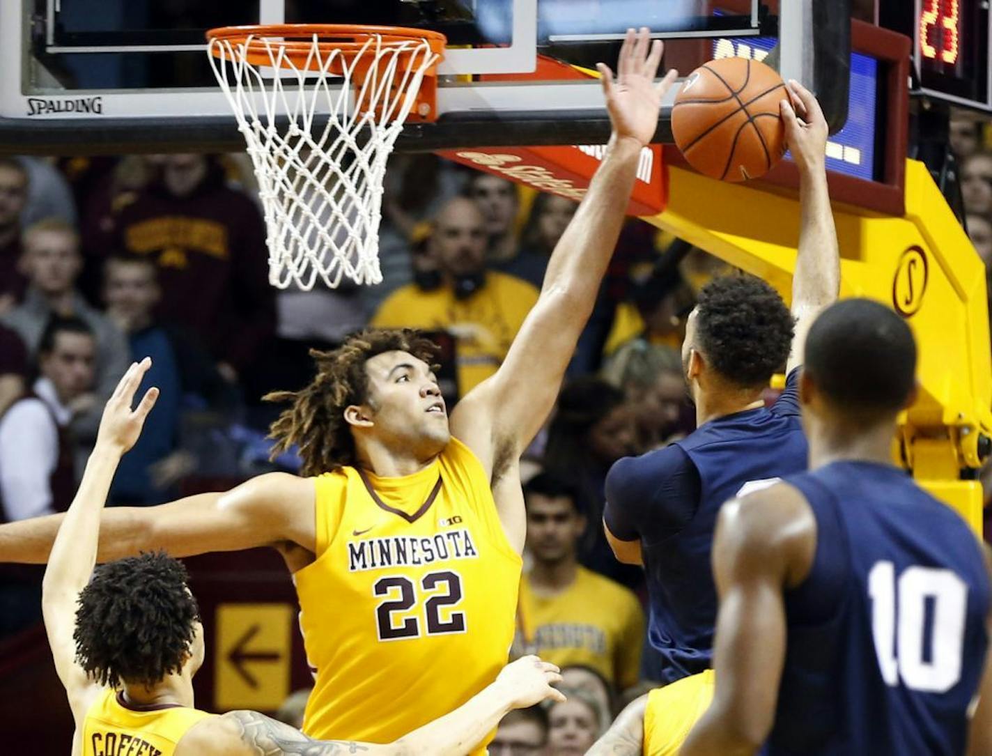 Minnesota's Reggie Lynch (22) makes his 11th block of the game as he blocks a shot by Penn State's Payton Banks last Saturday.