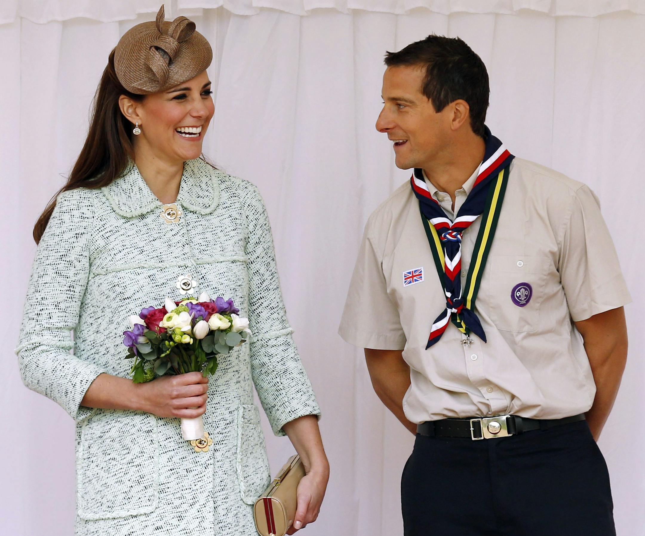 Britain's Duchess of Cambridge and Chief Scout Bear Grylls attend the National Review of Queen's Scouts at Windsor Castle, near London Sunday, April 21, 2013. (AP Photo/Olivia Harris, Pool)