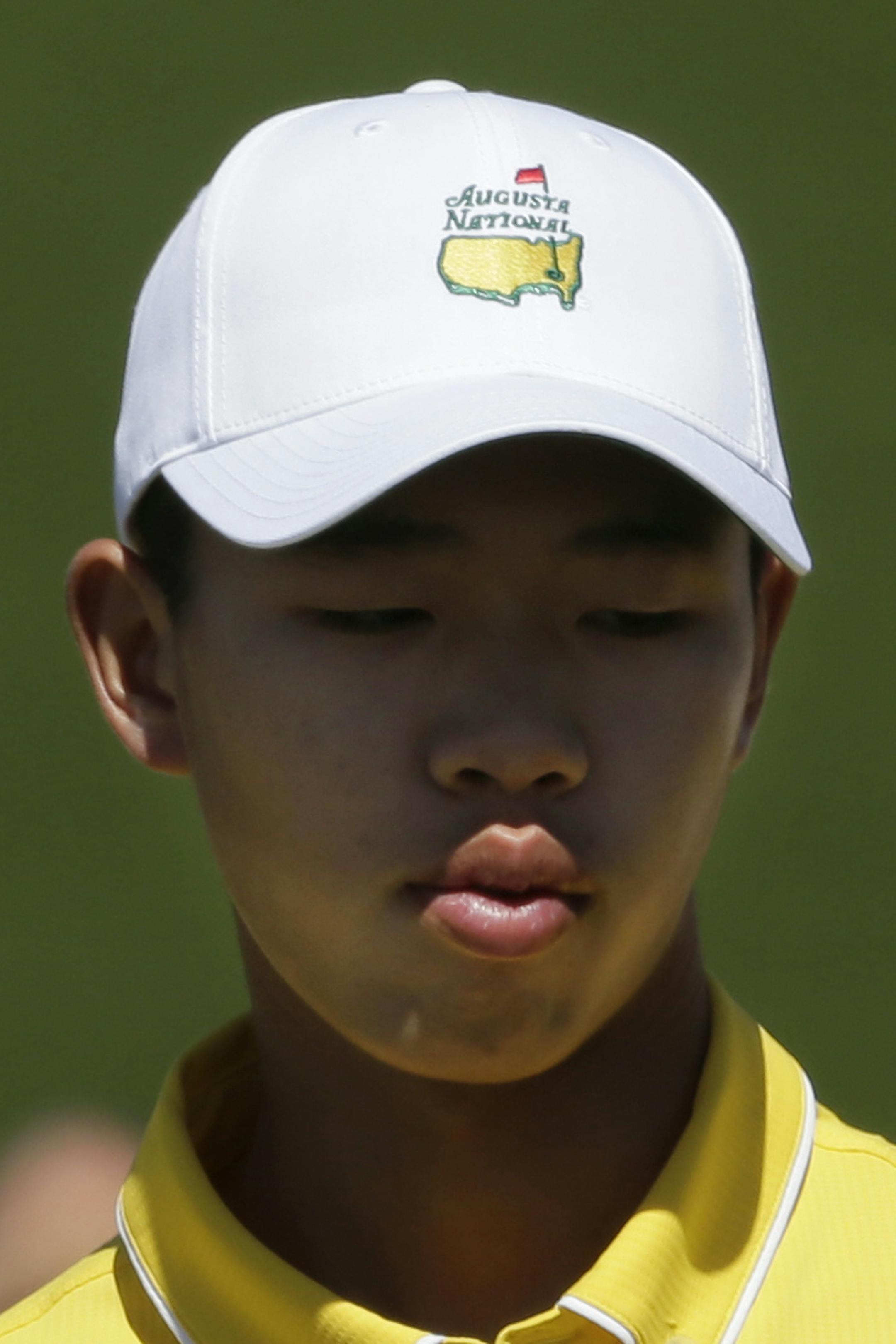 Amateur Guan Tianlang, of China, during the third round of the Masters golf tournament Saturday, April 13, 2013, in Augusta, Ga. (AP Photo/Charlie Riedel)