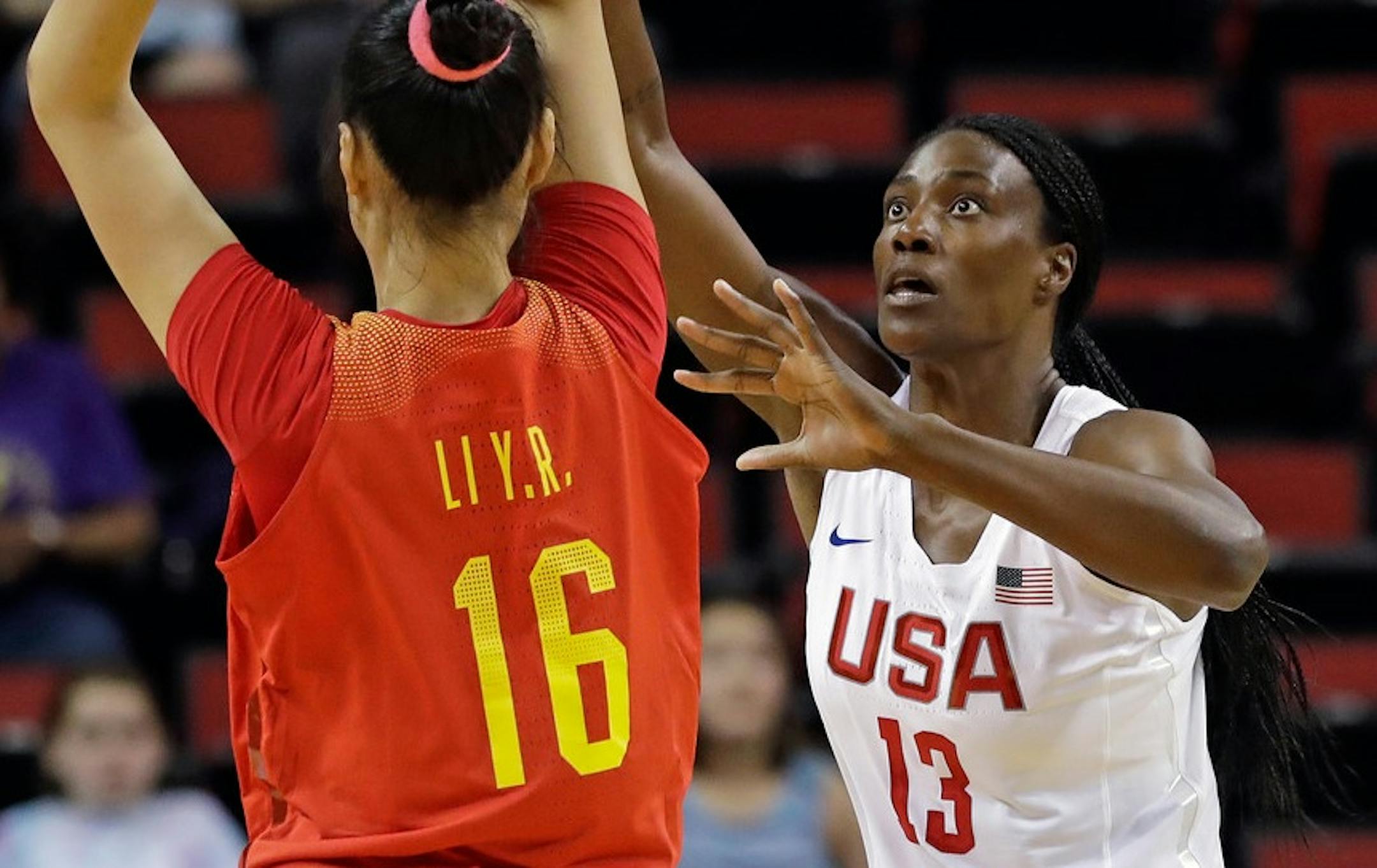 Sylvia Fowles (13) defends against China's Yueru Li during the first half of an exhibition basketball game Thursday, April 26, 2018, in Seattle. The United States won 83-46.