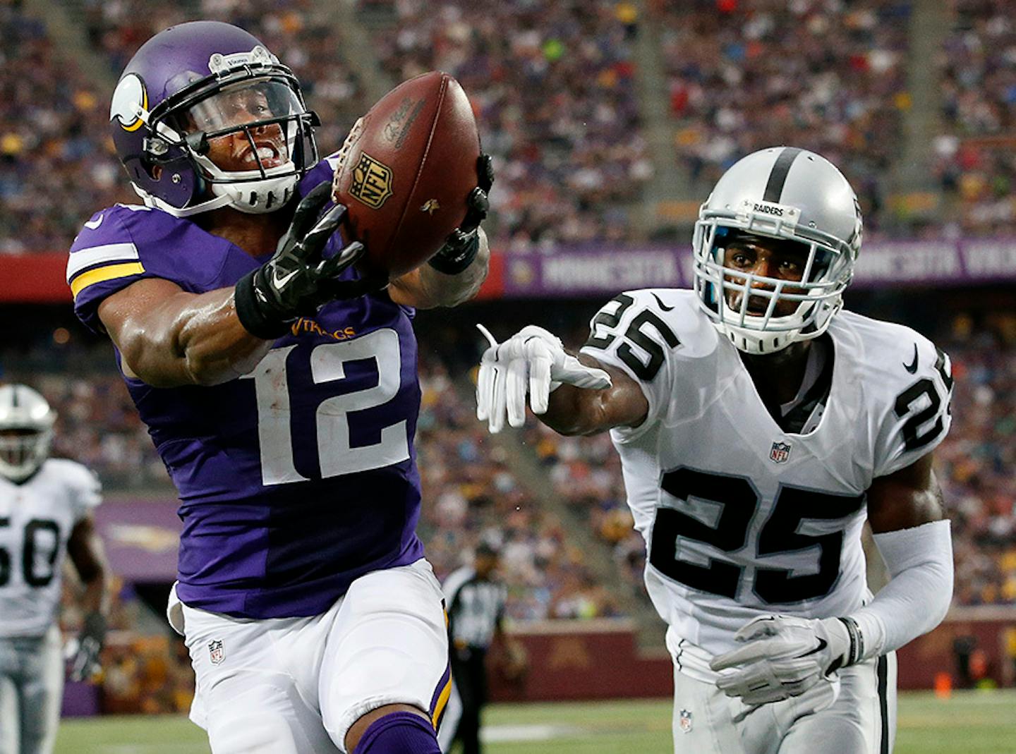 Charles Johnson (12) caught a pass for a touchdown while being defended by DJ Hayden (25) in the second quarter of a preseason game last month.