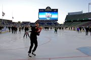 Wild employees, coaches and players were invited to skate with their families Friday night at TCF Bank Stadium. About 100 people were on the ice, whic