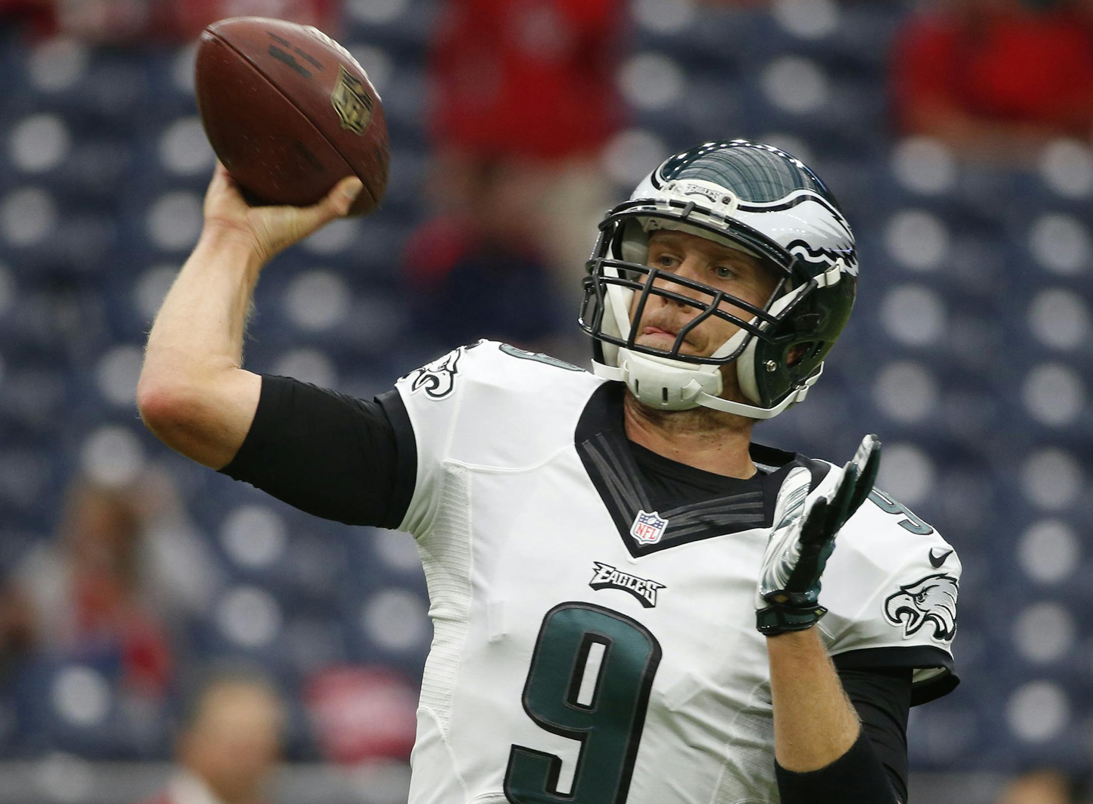 Philadelphia Eagles quarterback Nick Foles (9) warms up before the start of an NFL football game between the Houston Texans and the Philadelphia Eagles, Sunday, Nov. 2, 2014, in Houston. (AP Photo/Tony Gutierrez) ORG XMIT: HTT