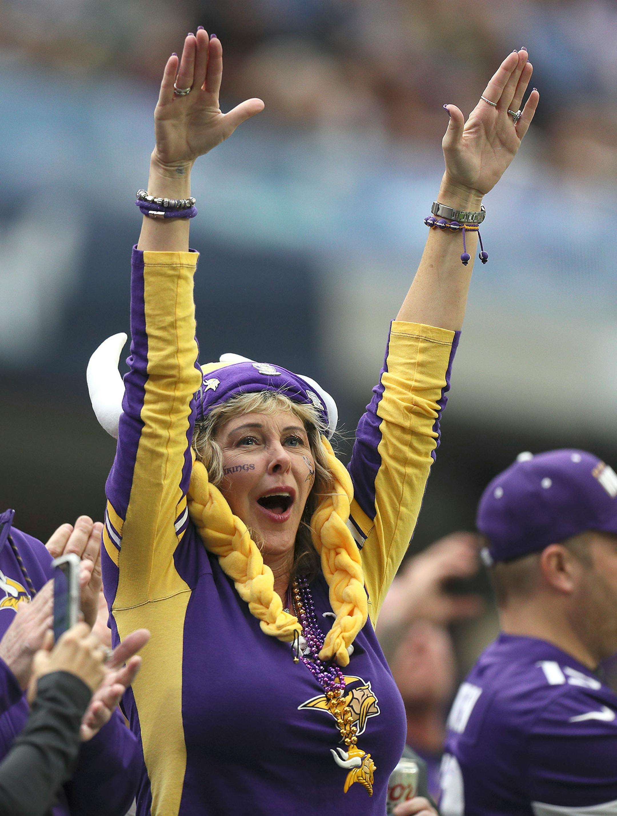 A Vikings fan in full regalia greeted her favorite team as players were introduced before the start of Sunday's game against the Cincinnati Bengals at U.S. Bank Stadium.