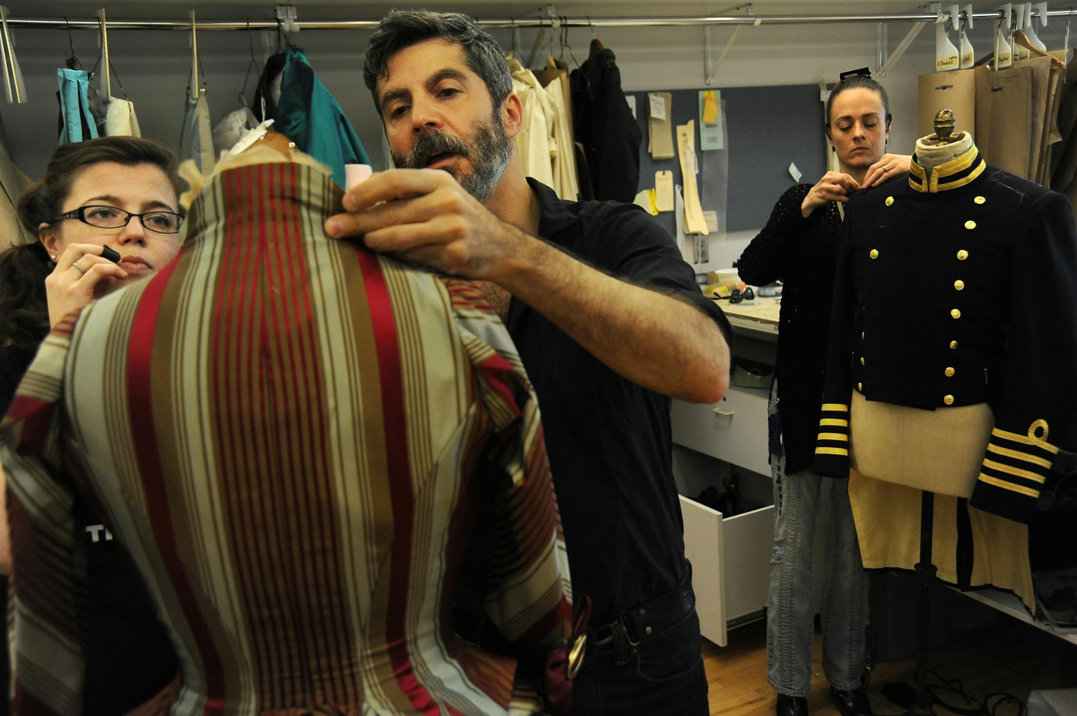 Costume designer Fabio Toblini discussed details of a dress for the guthrie's "H.M.S. Pinafore" with draper Diana Girtain.
