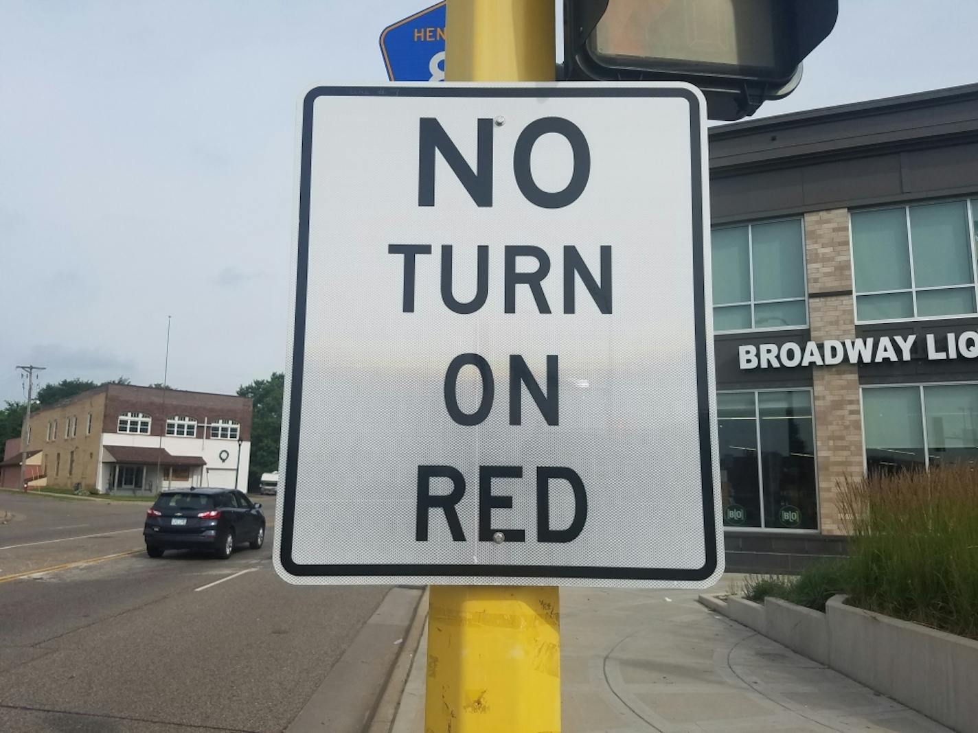 This "No Turn on Red" sign on northbound West Broadway at Penn Avenue N. is an older sign that the city will be replacing with one that meets current standards.