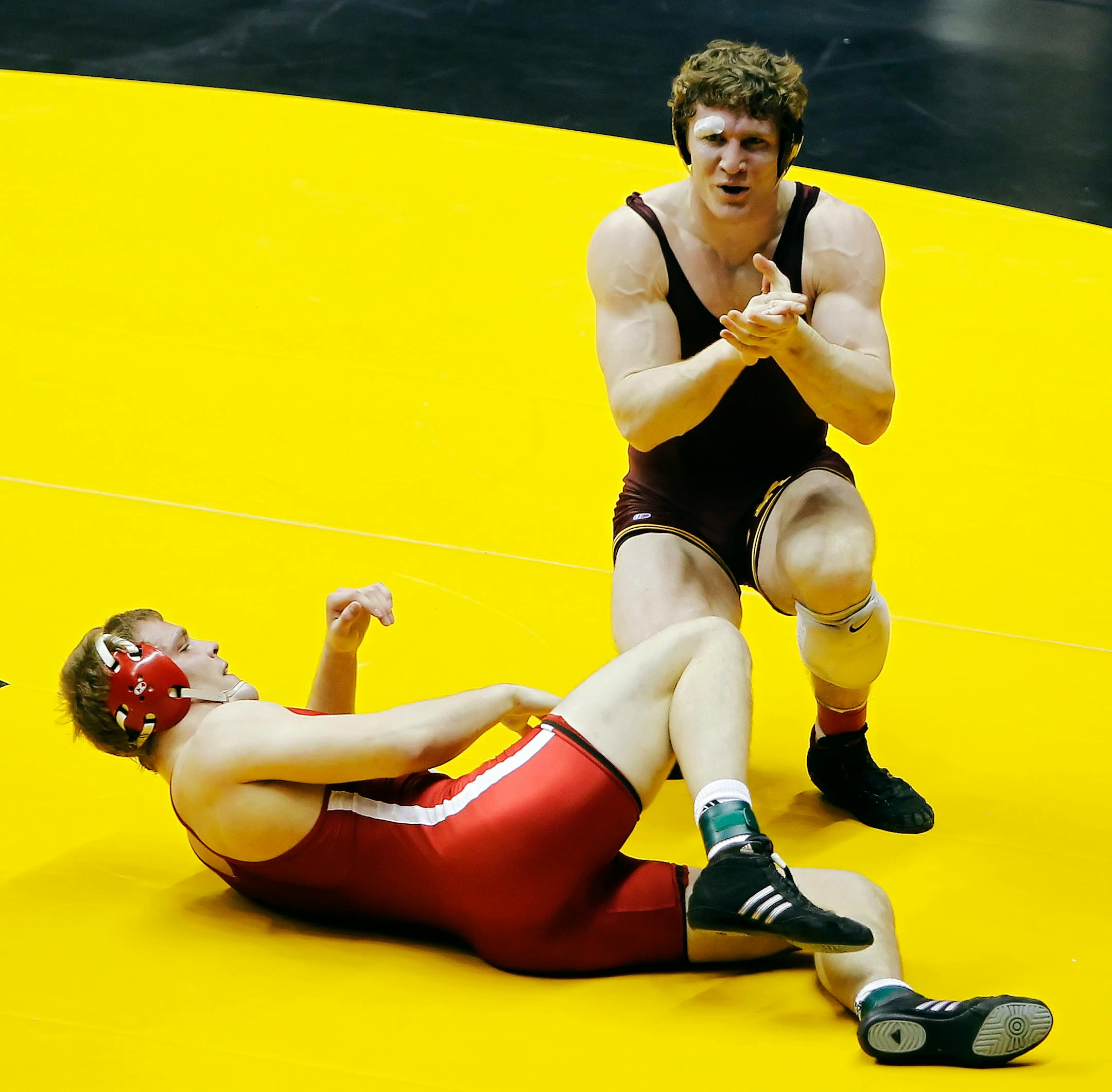 Minnesota's Kevin Steinhaus celebrates his 3-1 win over Nebraska's Josh Ihnen after their 184-pound match at the Big Ten NCAA college wrestling championship, Sunday, March 4, 2012, in West Lafayette, Ind. (AP Photo/The Journal & Courier, Michael Heinz) MANDATORY CREDIT; NO SALES