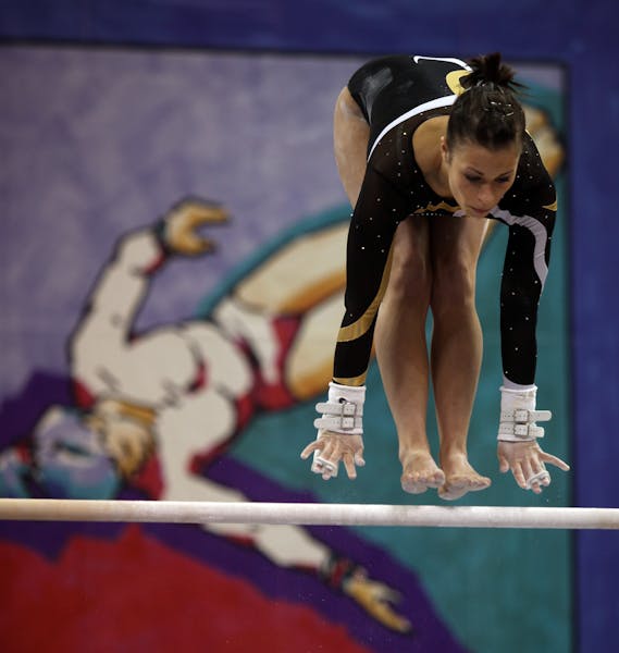 KYNDELL HARKNESS � kyndell.harkness@startribune.com MINNEAPOLIS- 2/26/10 Day one of 2 Class A state gymnastics competition at the U of M Sports Pavi