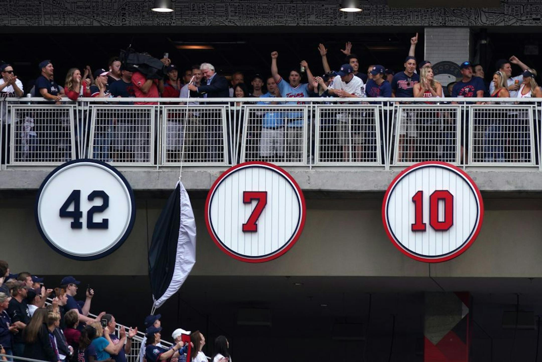 Former Minnesota Twins star Joe Mauer's retired number 7 was unveiled during a pre-game ceremony Saturday.