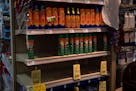 Shelves displayed sunscreen and mosquito spray for sale at a grocery store in Houston, Texas on May 16, 2024.