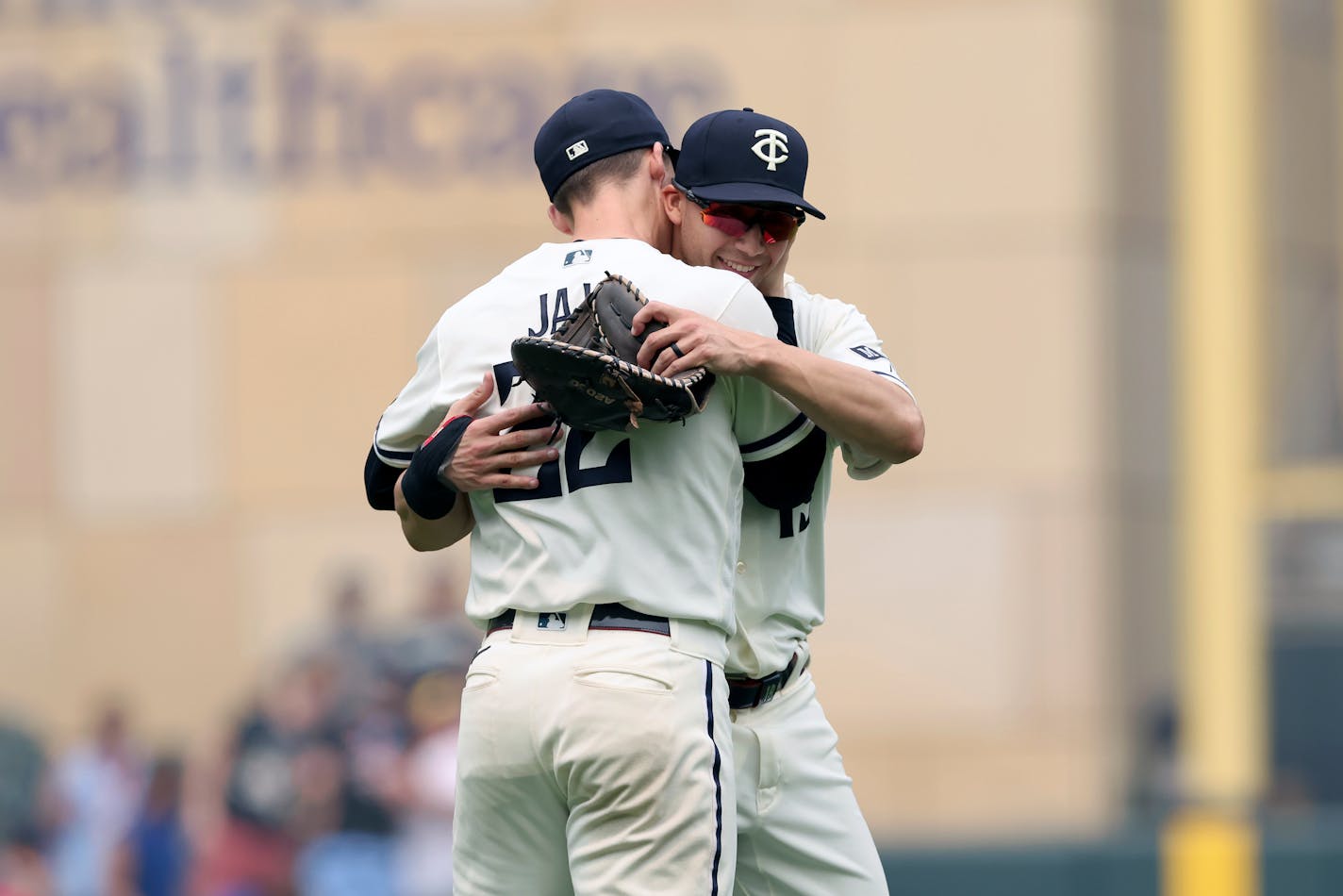 Minnesota Twins' Griffin Jax (22) celebrates with Alex Kirilloff (19) after winning 4-2 against the Milwaukee Brewers following a baseball game Wednesday, June 14, 2023, in Minneapolis. (AP Photo/Stacy Bengs)