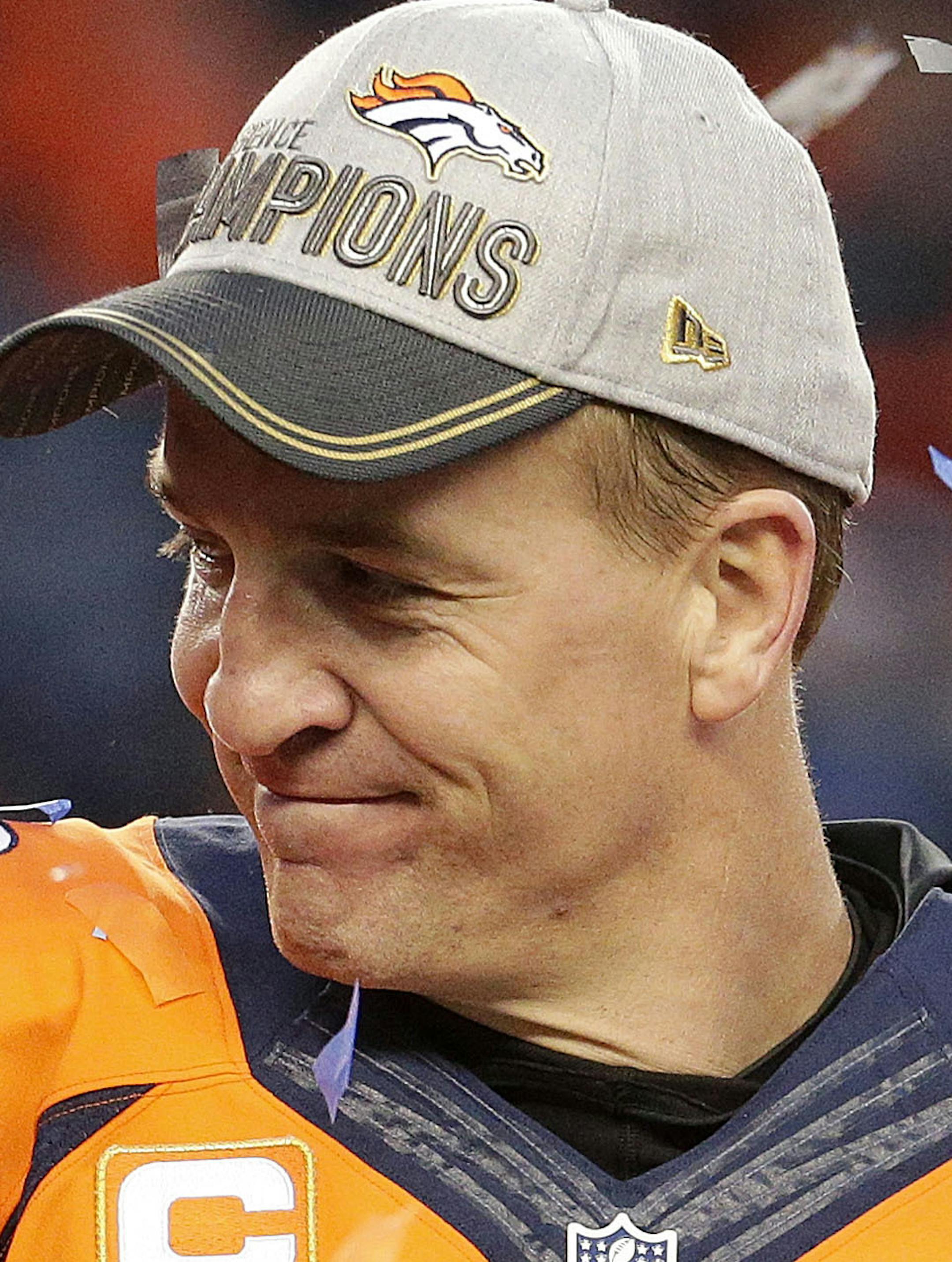 Denver Broncos quarterback Peyton Manning holds the AFC Championship trophy following the NFL football AFC Championship game between the Denver Broncos and the New England Patriots, Sunday, Jan. 24, 2016, in Denver. The Broncos defeated the Patriots 20-18 to advance to the Super Bowl. (AP Photo/Charlie Riedel)