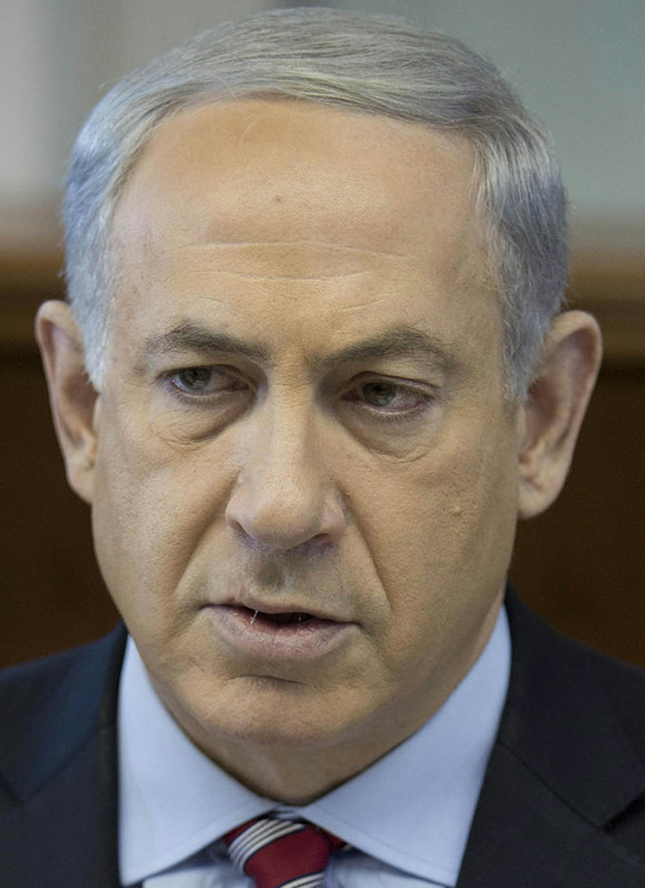 Israeli Prime Minister Benjamin Netanyahu attends the weekly cabinet meeting at his office in Jerusalem, Israel, Sunday, Nov. 24, 2013. After feverishly trying to derail the international community's nuclear deal with Iran in recent weeks, Israeli Prime Minister Benjamin Netanyahu now has little choice but to accept an agreement that he has derided as deeply flawed. (AP Photo/Abir Sultan, Pool) ORG XMIT: MIN2013112516121664