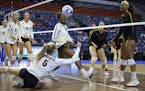 Minnesota Gophers' Alyssa Goehner (5) dives to dig a ball up during the Regional Semi-Final match against USC in the NCAA Volleyball Championships at 