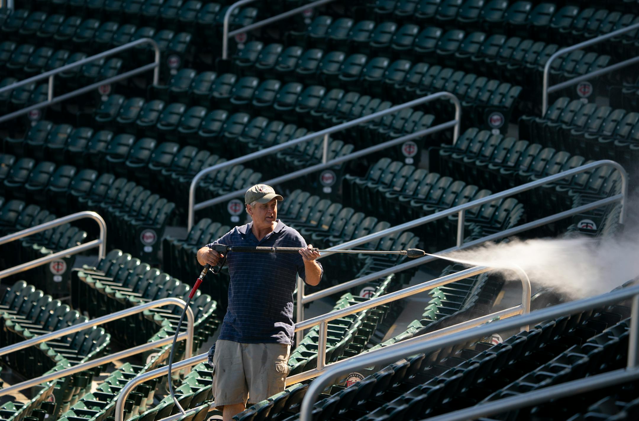 While the Twins wrapped up their first full squad workout, John Dix power washed the seats in Hammond Stadium in preparation for fans sitting in them starting Sunday.