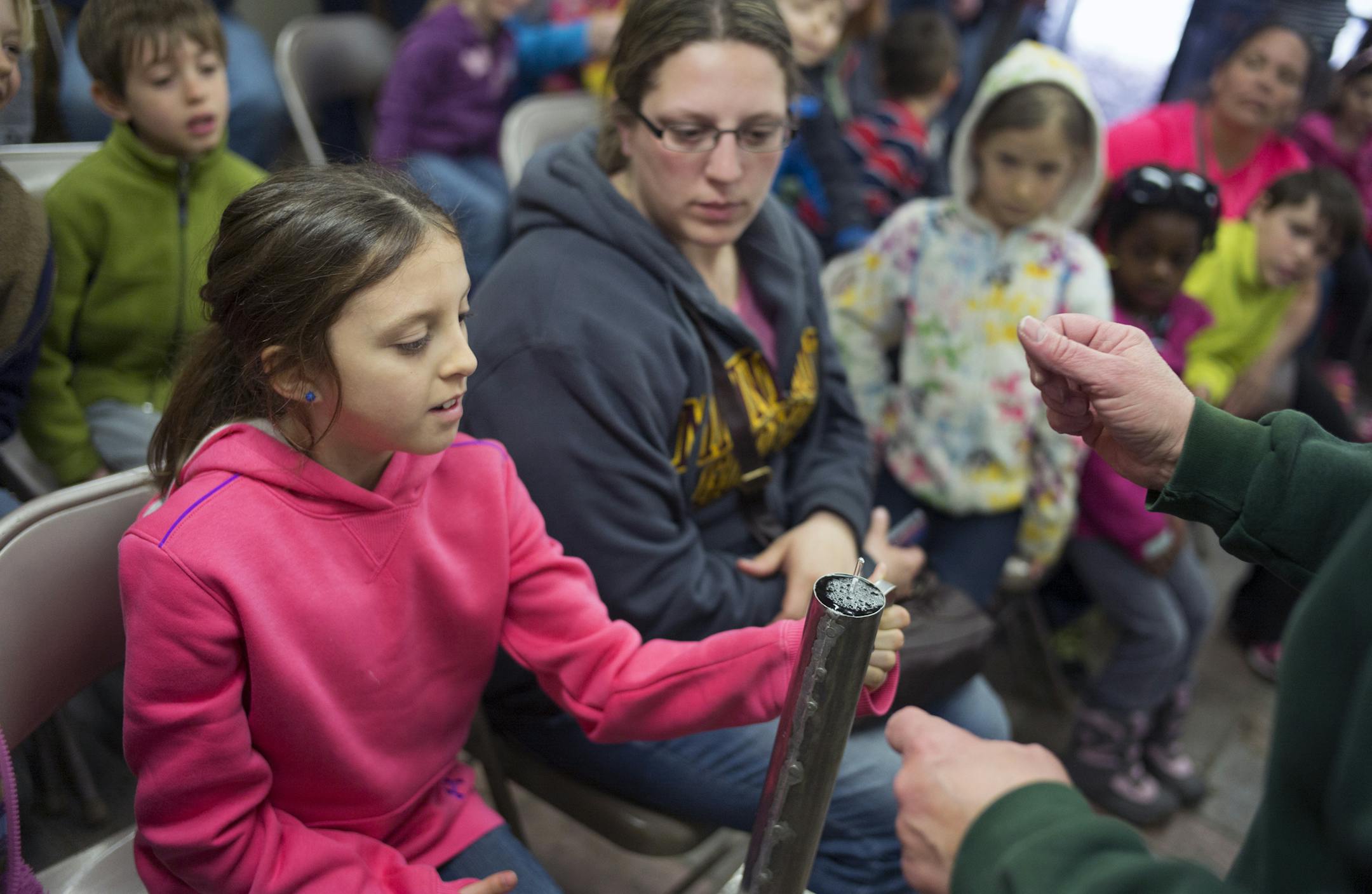 At the Carpenter Nature Center in Hastings where they were tapping box elders for syrup, Kaylie Blue,9, of Hastings watched how a hydrometer can tell you how much sugar is in the sap .]Richard Tsong-Taatarii/rtsong-taatarii@startribune.com