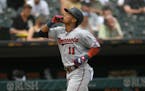 Minnesota Twins’ Jorge Polanco (11) celebrates while rounding the bases after hitting a two-run home run during the fifth inning of a baseball game 