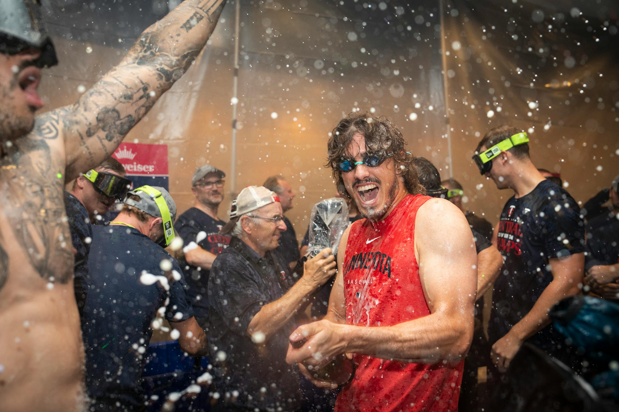 Twins players celebrate with champagne in the locker room after clentched the American League Central title. The Minnesota Twins hosted the Los Angeles Angels at Target Field on Friday, Sept. 22, 2023 in Minneapolis, Minn. ] RENEE JONES SCHNEIDER • renee.jones@startribune.com