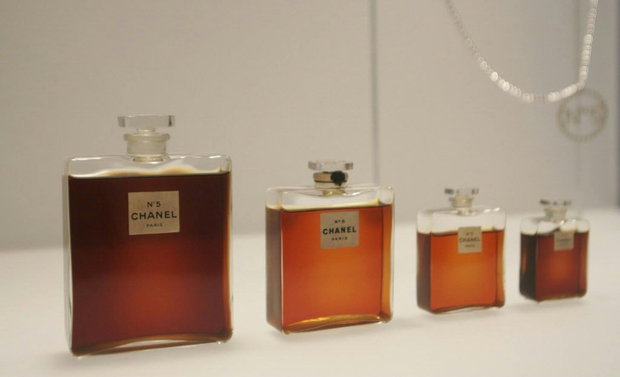 FILE - In this May 2, 2005 file photo, bottles of Chanel No. 5 perfume are displayed at the Metropolitan Museum of Art's Costume Institute exhibit in New York. Chanel is making a stink over a possible high-speed train line through jasmine fields in Provence, warning it could threaten production of its Chanel No. 5 perfume.
