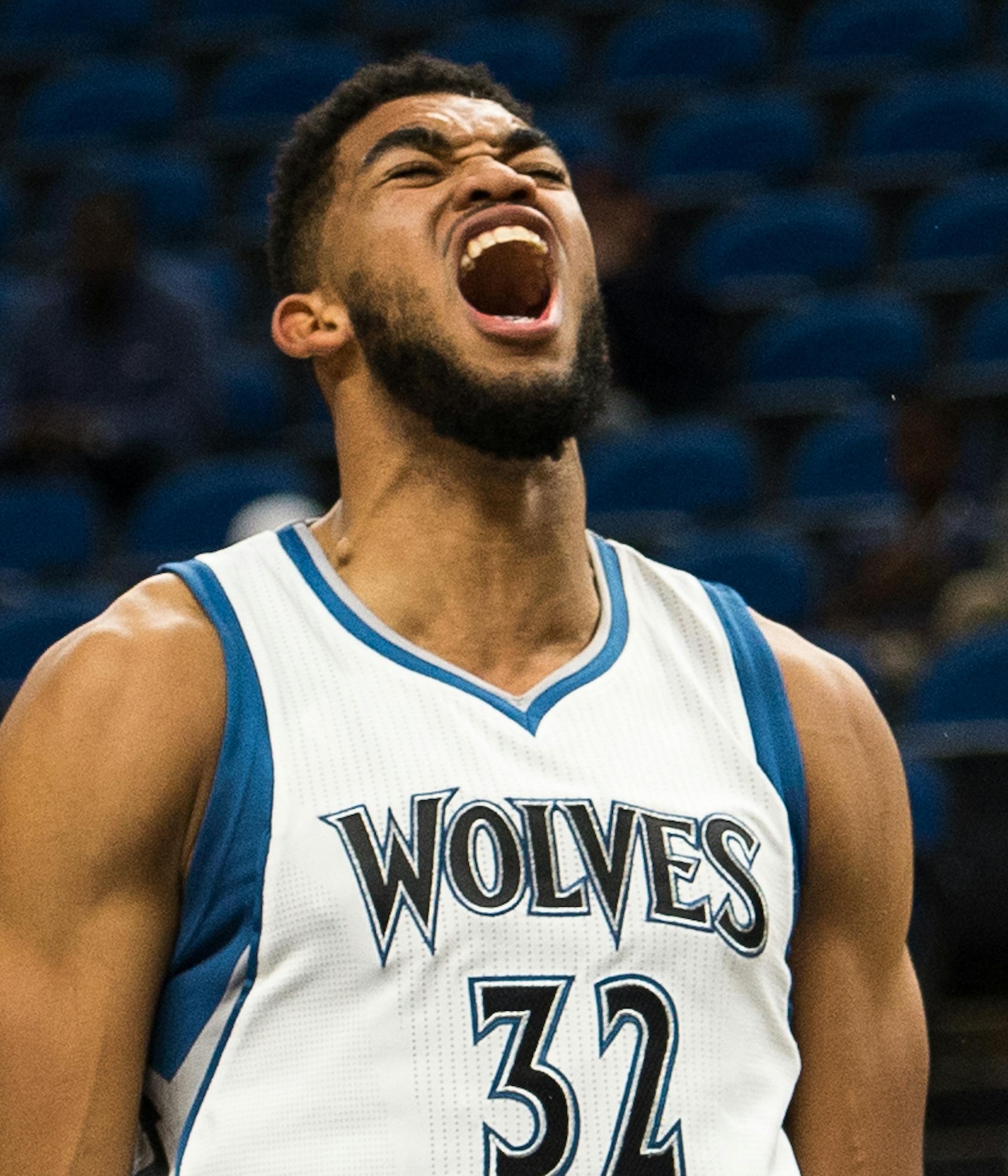 Minnesota Timberwolves forward Karl-Anthony Towns (32) let out a roar after dunking in the first quarter against the Memphis Grizzlies. ] (AARON LAVINSKY/STAR TRIBUNE) aaron.lavinsky@startribune.com The Minnesota Timberwolves played the Memphis Grizzlies in a preseason game on Wednesday, Oct. 19, 2016 at Target Center in Minneapolis, Minn.