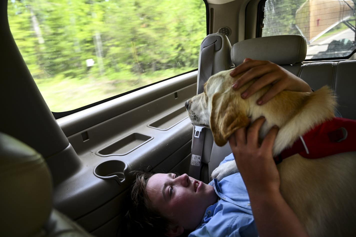 Aidan Jones rested with his dog, Crosby, after a successful trip in the Boundary Waters Saturday. ] Aaron Lavinsky &#xa5; aaron.lavinsky@startribune.com DAY 5 - Tony Jones, his 14-year old son Aidan , their friend Brad Shannon and Outdoors editor Bob Timmons started the day on South Fowl Lake on Saturday, June 15, 2019. From there, they portaged into Royal lake and then again into John Lake where they had a car waiting for them nearby. They drove to Grand Marais, where they were able to get Tony