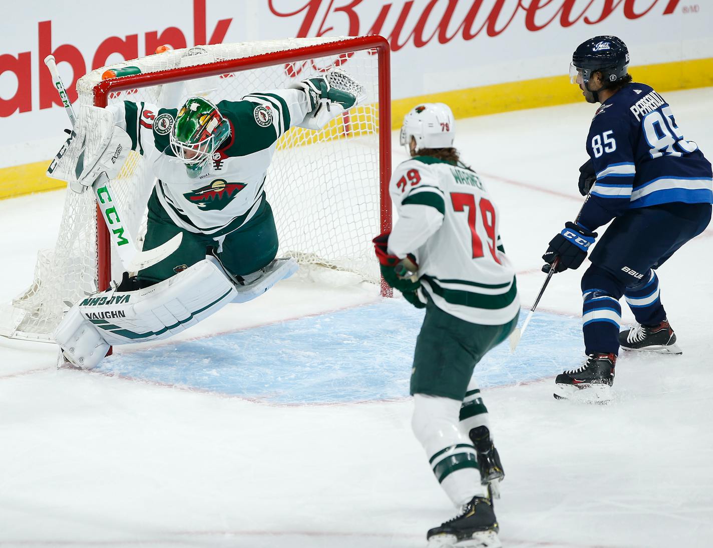 Wild goaltender Kaapo Kahkonen saved this shot from Winnipeg's Mathieu Perreault during the first period but by then the Jets already had a 2-0 lead.