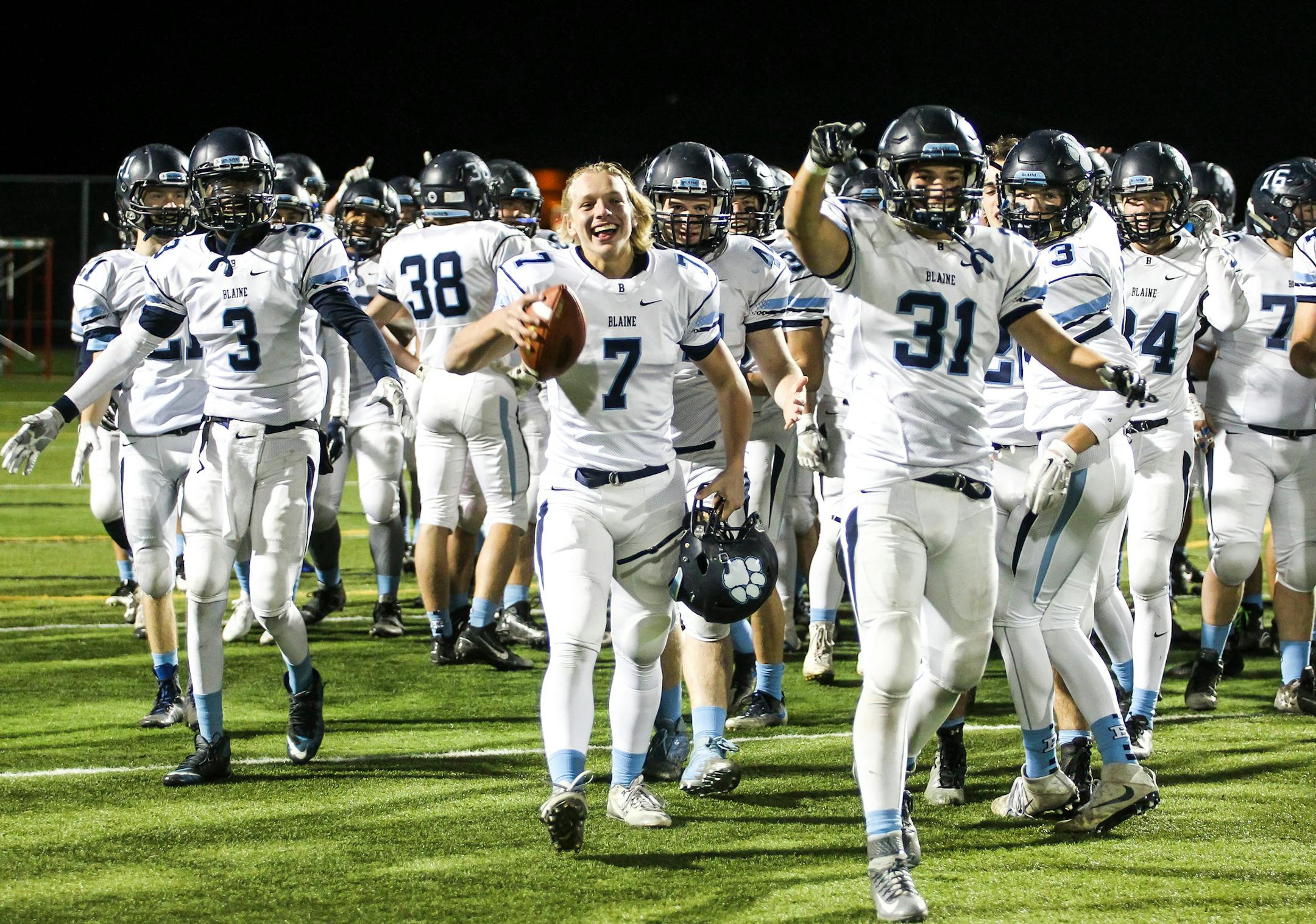 Blaine quarterback Connor Melton (7) acknowledged the student section after the Bengals’ 39-14 win over Minnetonka in the Class 6A quarterfinals.