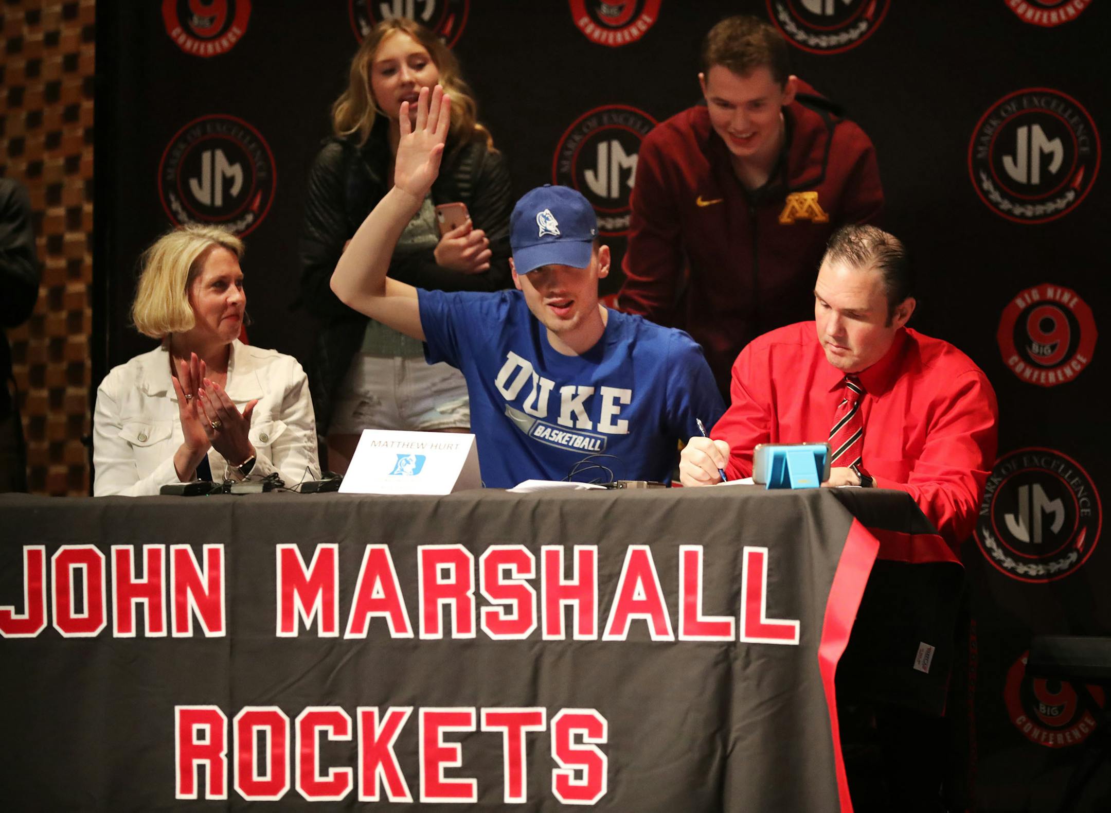 Matthew Hurt of Rochester John Marshall, one of the top senior basketball recruits in the nation, tips his Duke hat after announcing his college plans.